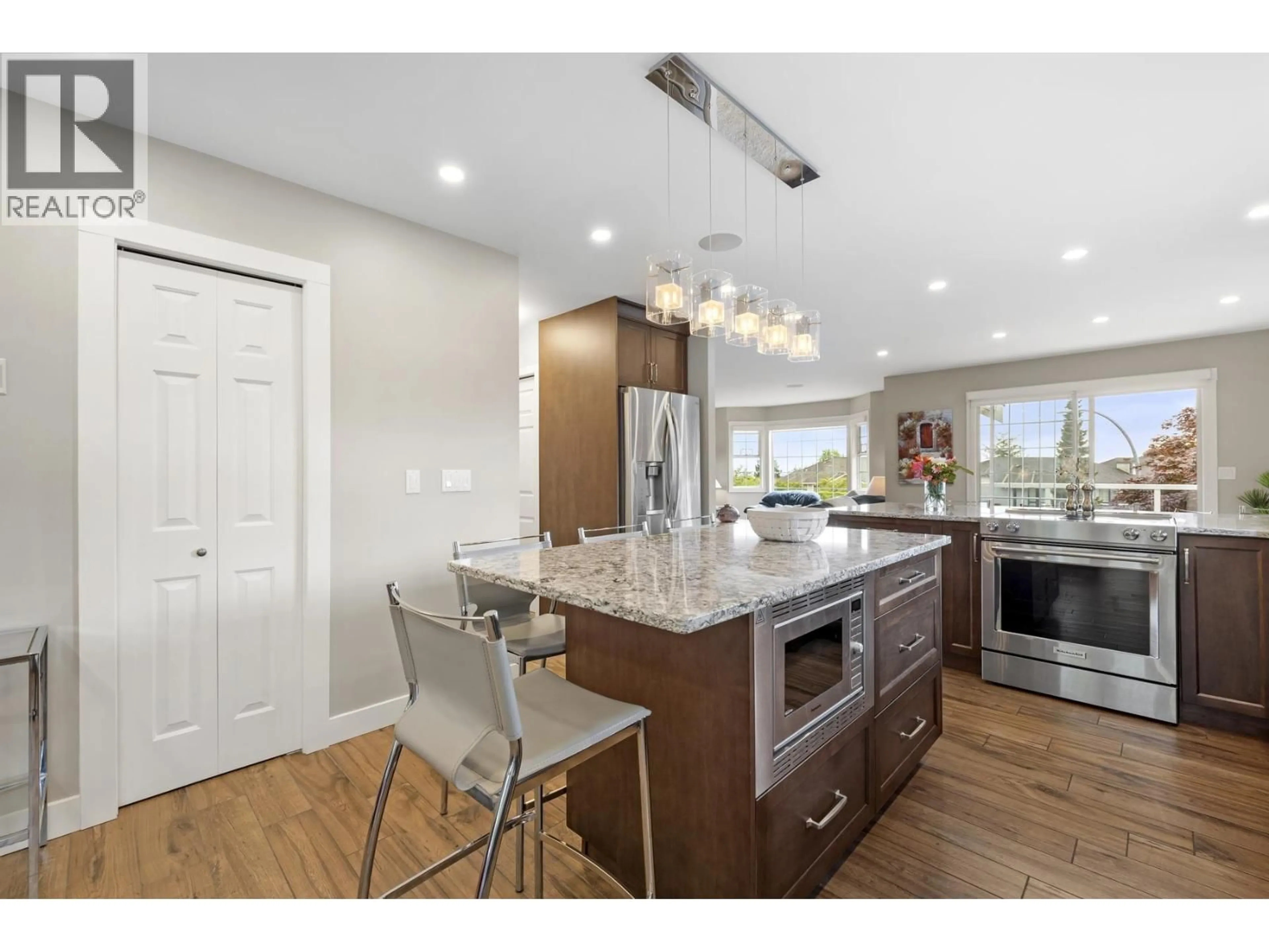Open concept kitchen, wood/laminate floor for 1255 KENSINGTON PLACE, Port Coquitlam British Columbia V3C5N9