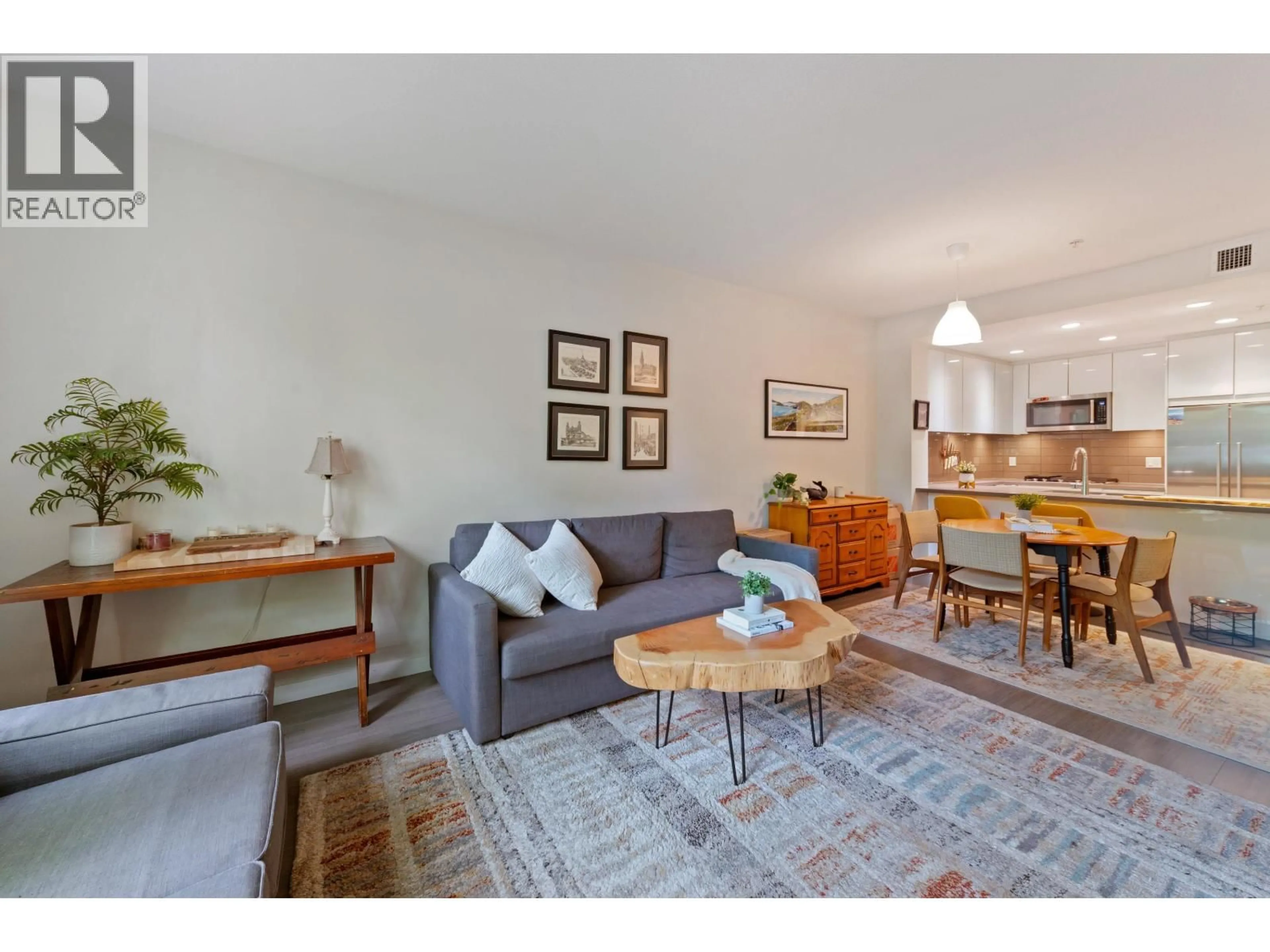 Living room with furniture, wood/laminate floor for 216 - 255 W 1ST STREET, North Vancouver British Columbia V7M3G8
