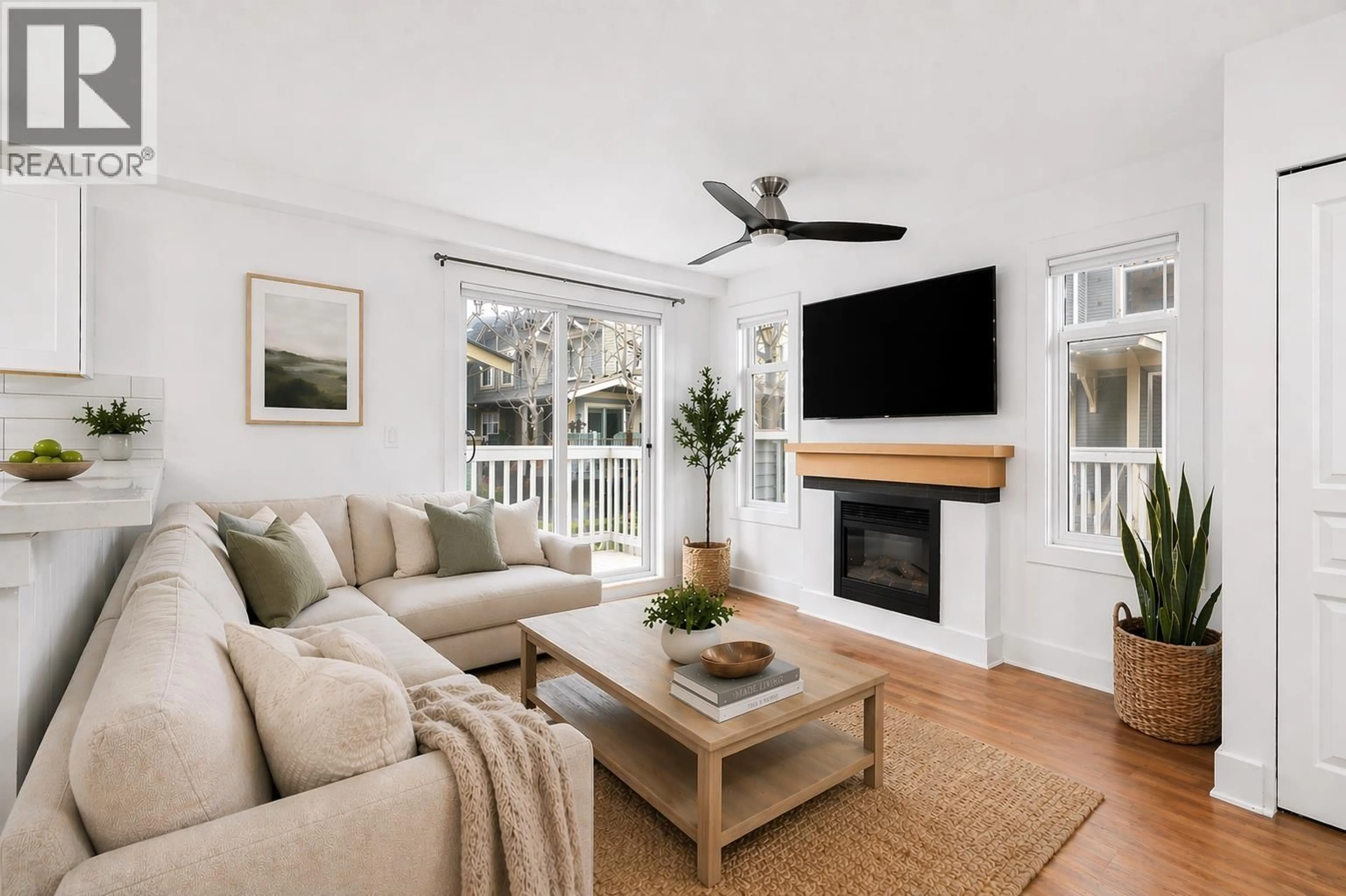 Living room with furniture, wood/laminate floor for 30 - 7428 SOUTHWYNDE AVENUE, Burnaby British Columbia V3N0A1