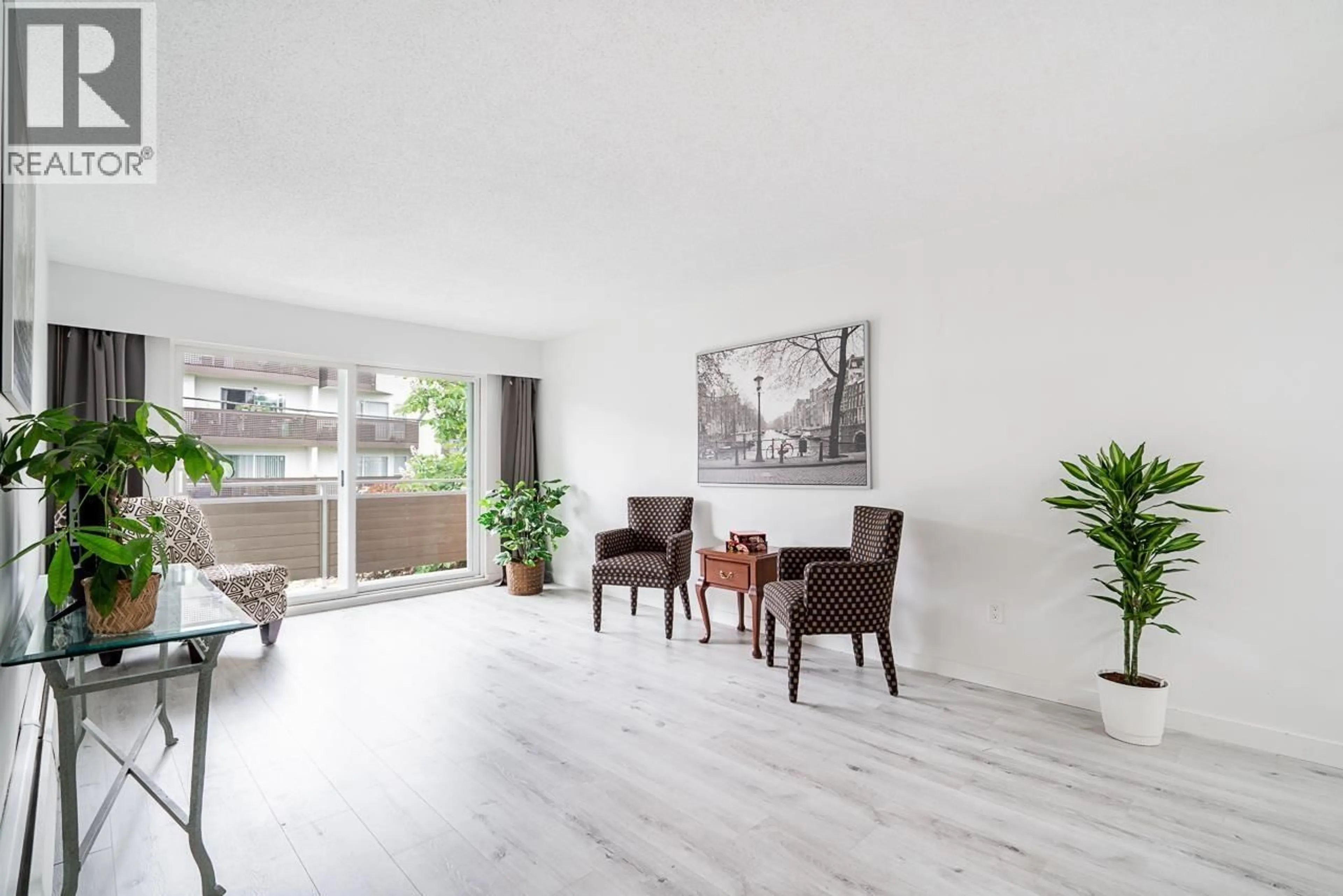 Living room with furniture, wood/laminate floor for 318 - 750 7TH AVENUE, Vancouver British Columbia V5T4H5