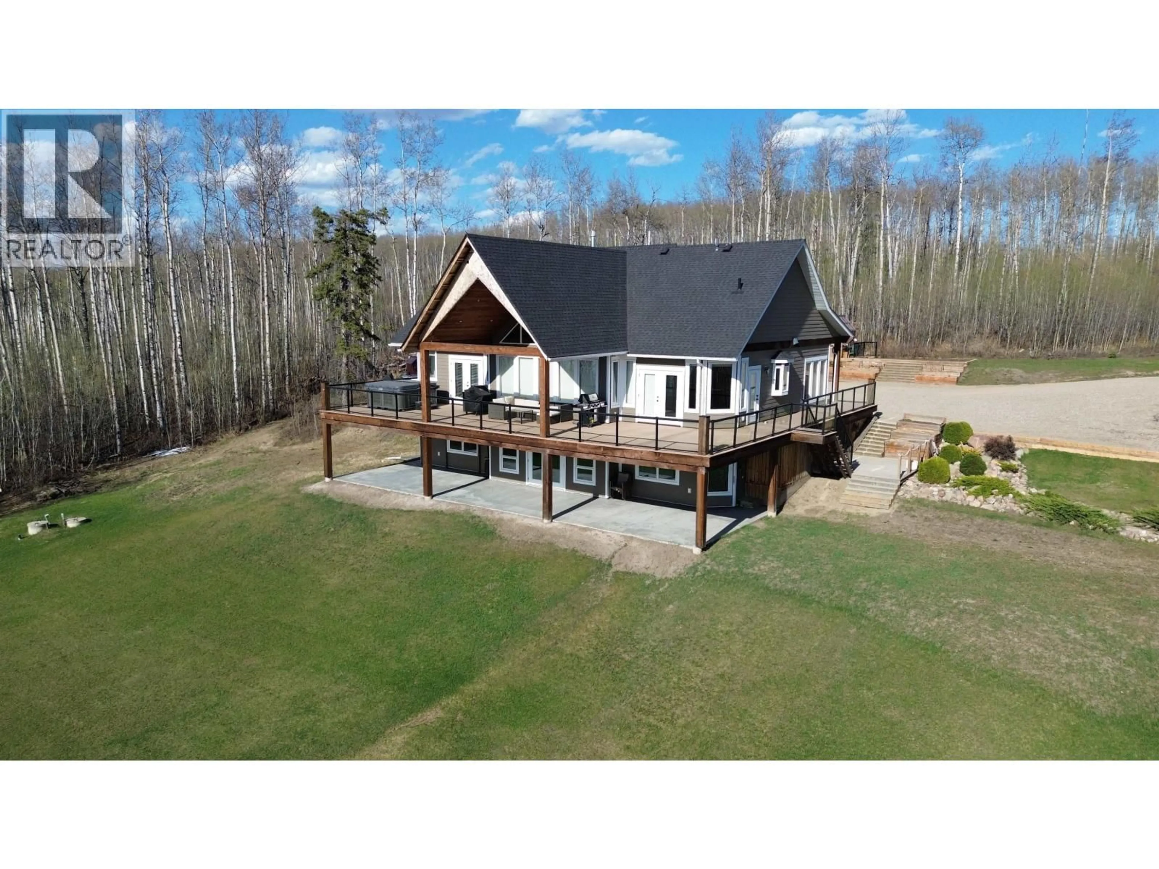 A pic from outside/outdoor area/front of a property/back of a property/a pic from drone, water/lake/river/ocean view for 13474 SUNNYSIDE DRIVE, Charlie Lake British Columbia V0C1H0