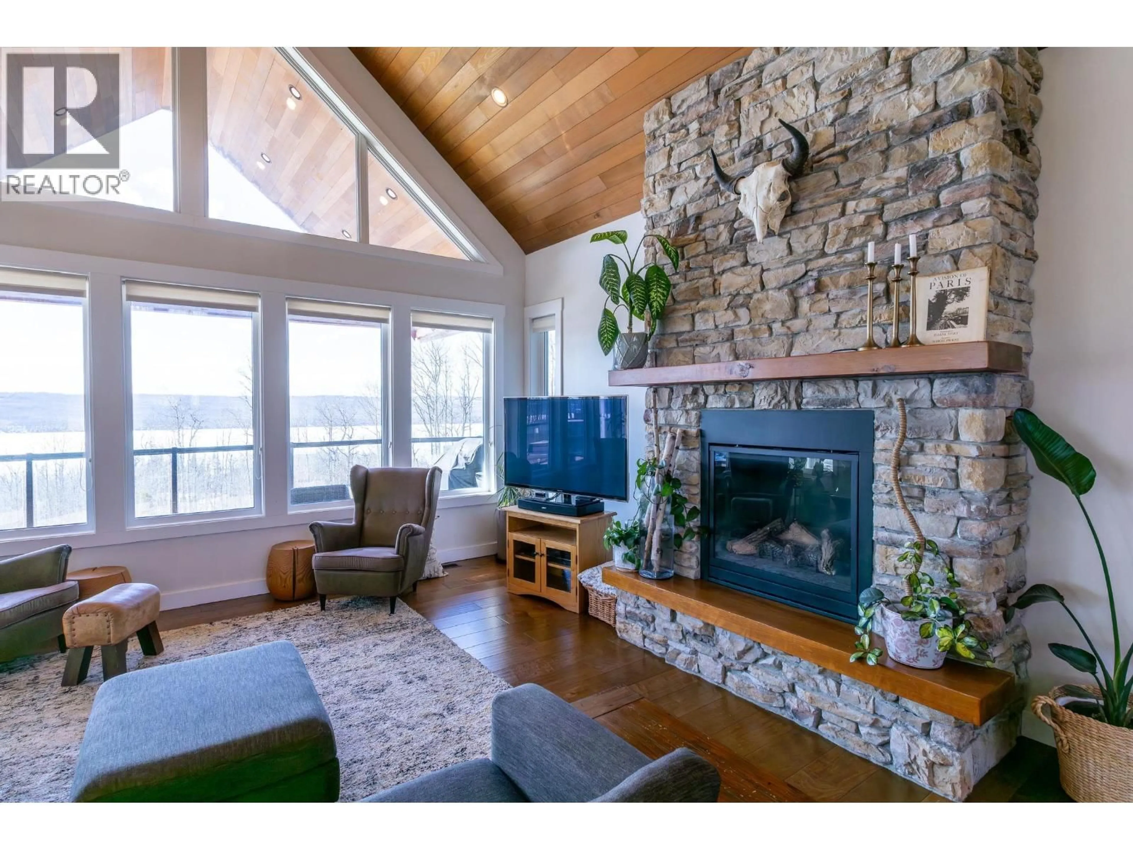 Living room with furniture, wood/laminate floor for 13474 SUNNYSIDE DRIVE, Charlie Lake British Columbia V0C1H0