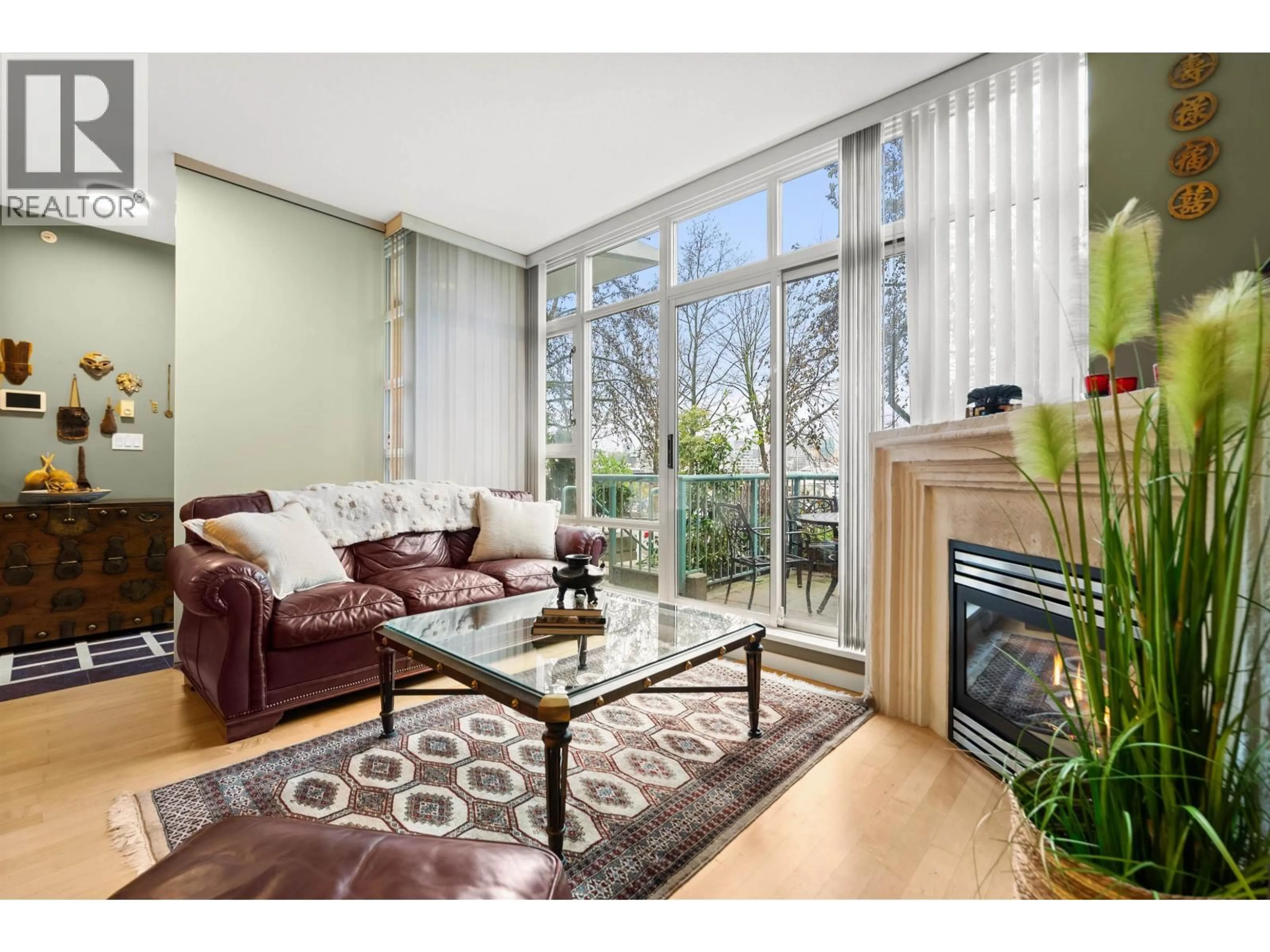 Living room with furniture, wood/laminate floor for 1053 MARINASIDE CRESCENT, Vancouver British Columbia V6Z3A5