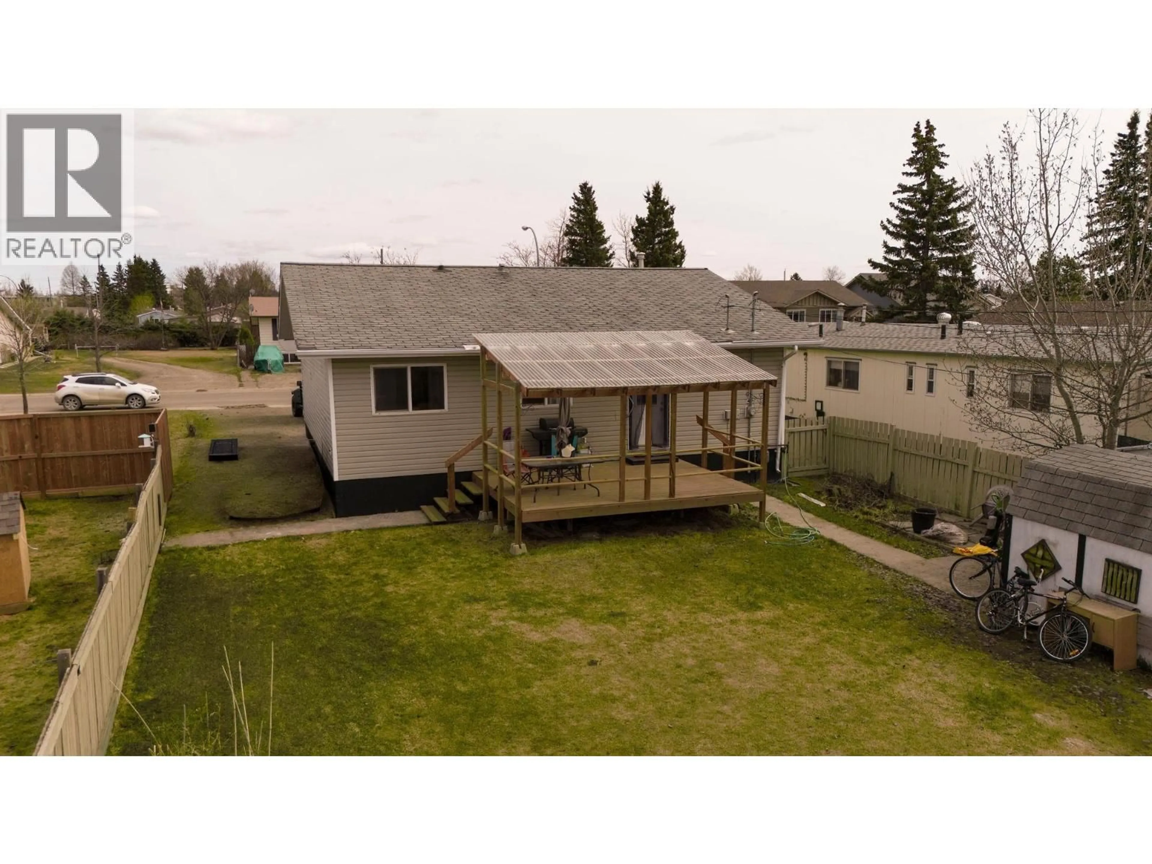 A pic from outside/outdoor area/front of a property/back of a property/a pic from drone, building for 9016 77 STREET, Fort St. John British Columbia V1J3A6