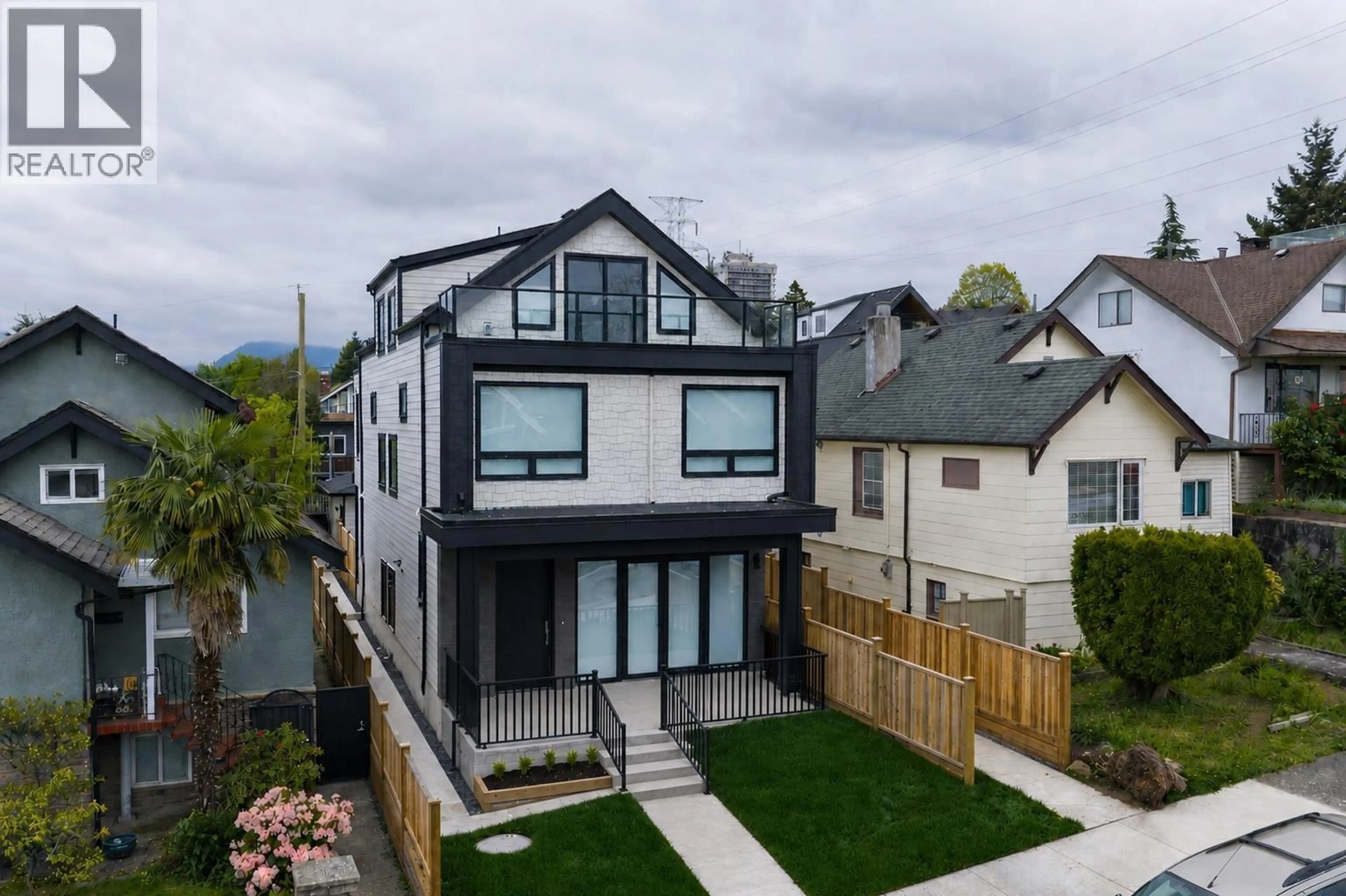 A pic from outside/outdoor area/front of a property/back of a property/a pic from drone, mountain view for 1 - 3645 DUNDAS STREET, Vancouver British Columbia V5K1S3