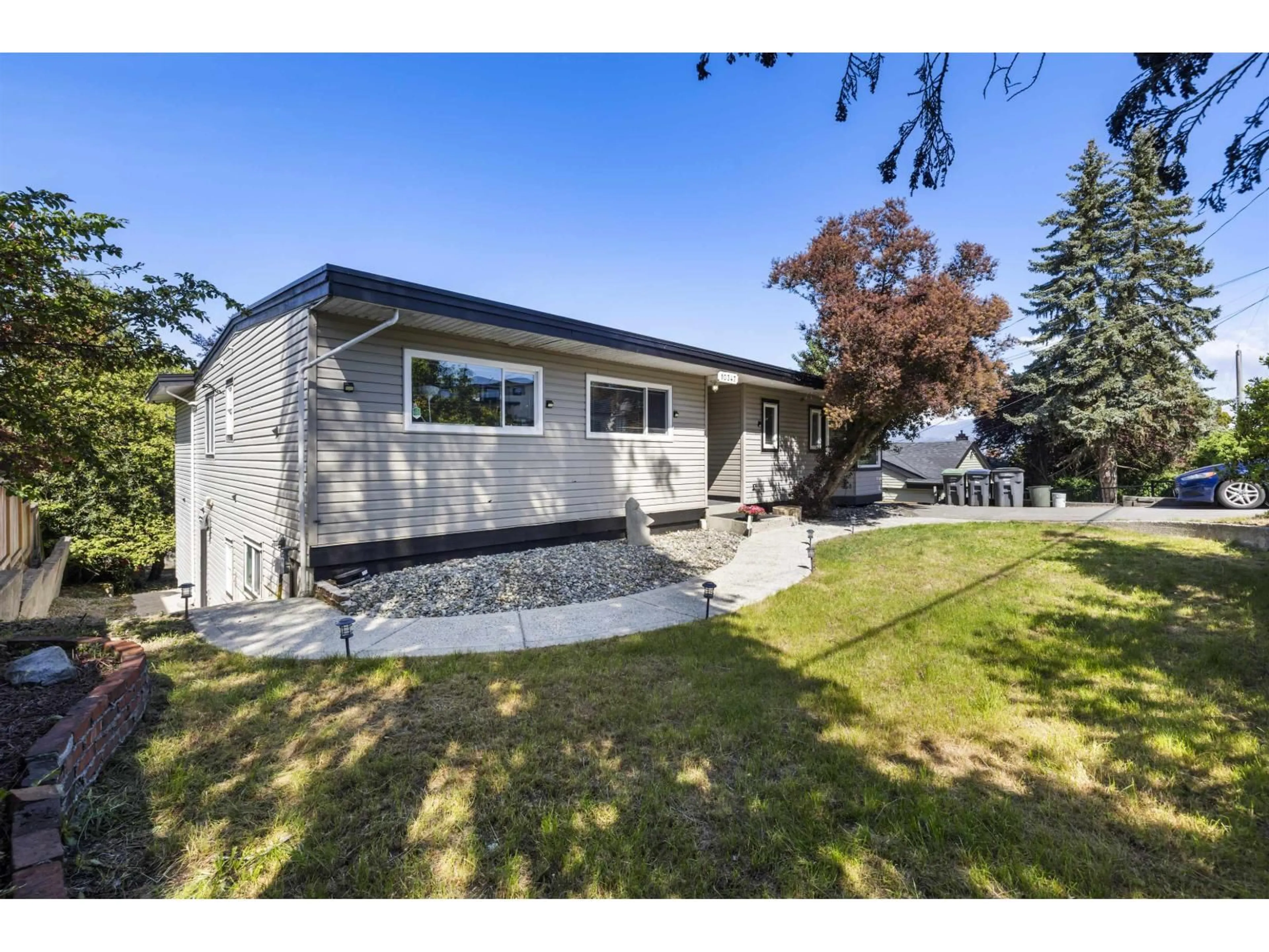 Home with vinyl exterior material, street for 10347 125 STREET, Surrey British Columbia V3V4Y6