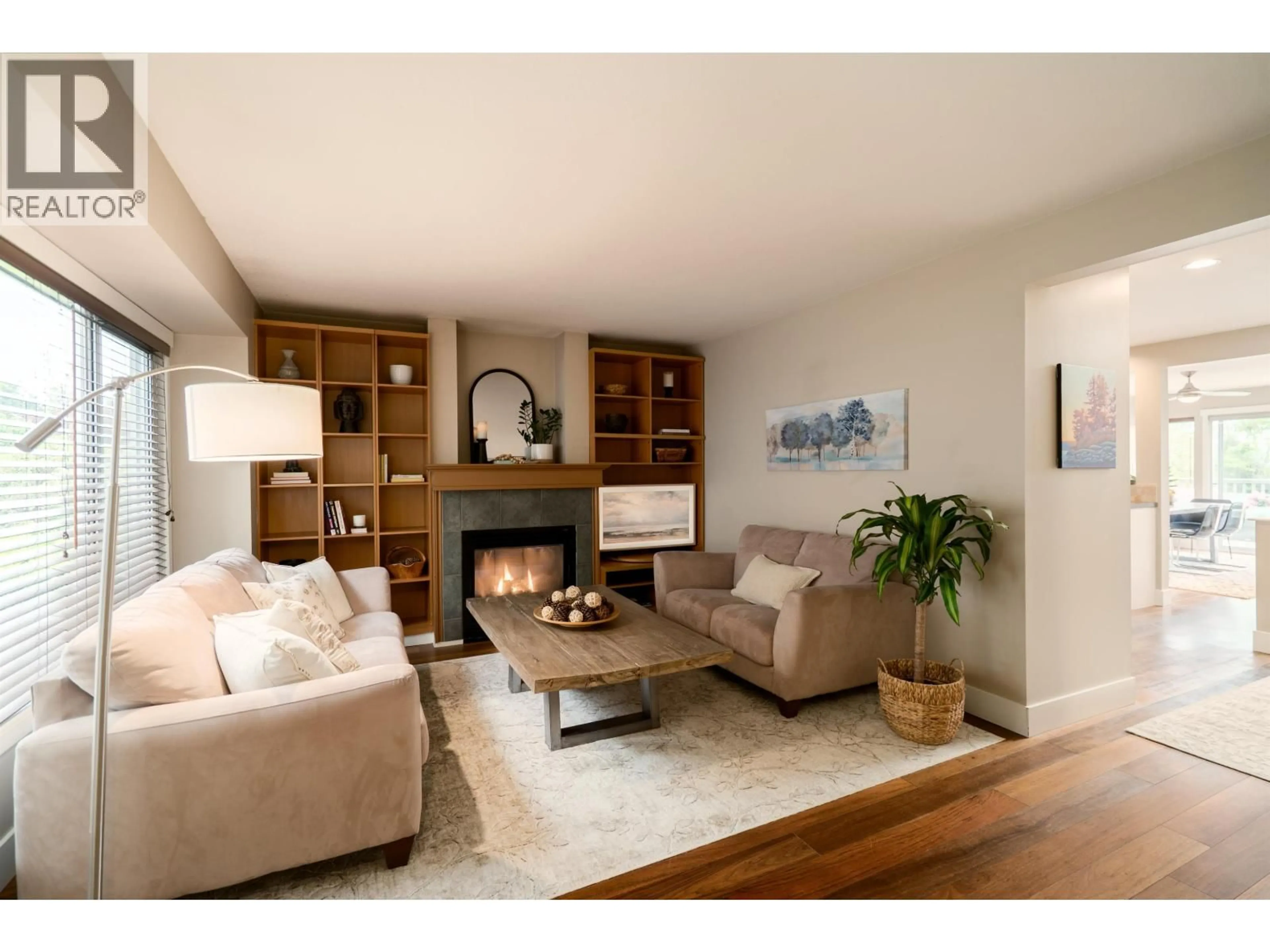 Living room with furniture, wood/laminate floor for 939 CALVERHALL STREET, North Vancouver British Columbia V7L1Y1