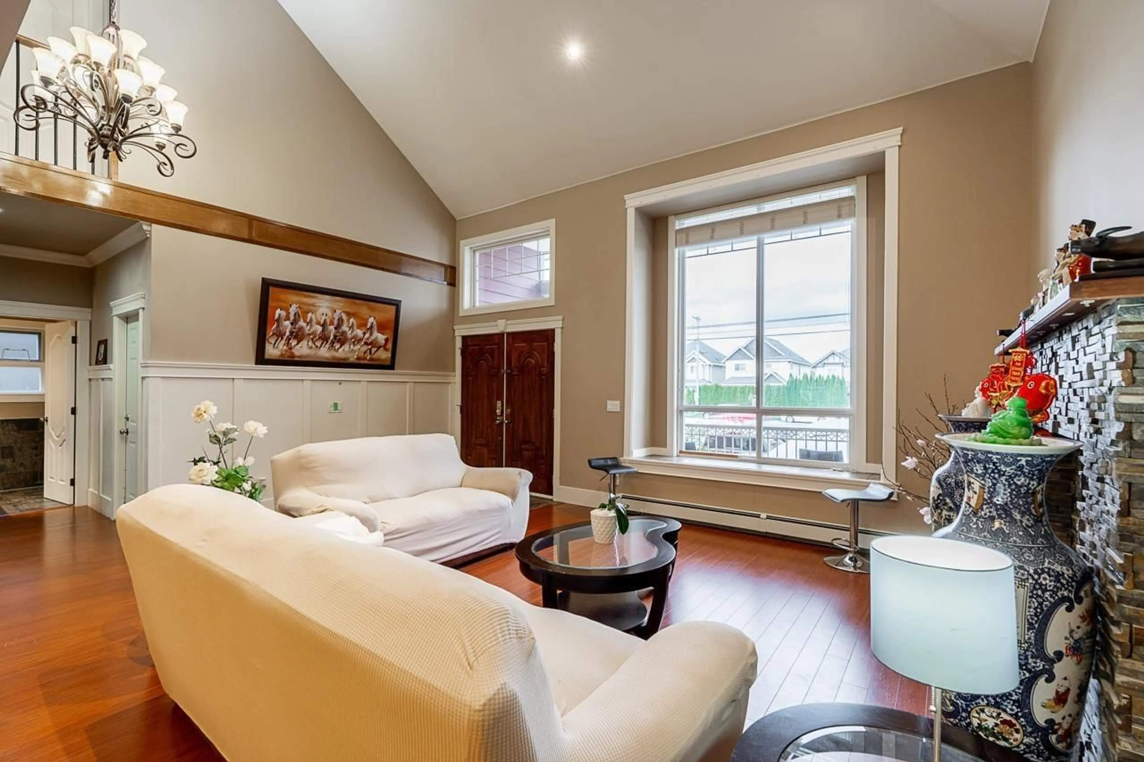 Living room with furniture, wood/laminate floor for 27760 PULLMAN AVENUE, Abbotsford British Columbia V4X0A2