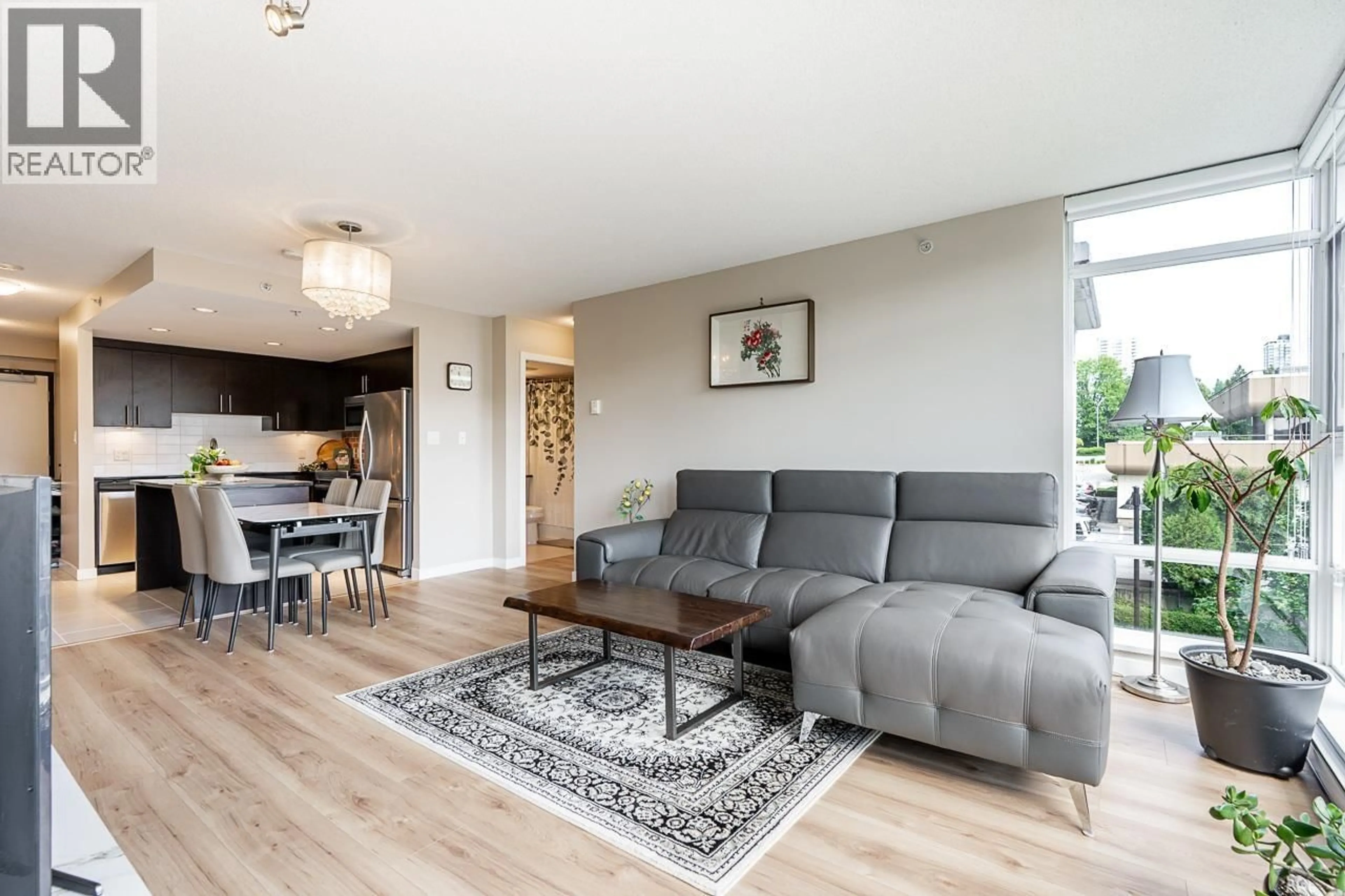 Living room with furniture, wood/laminate floor for 304 - 575 DELESTRE AVENUE, Coquitlam British Columbia V3K0A6