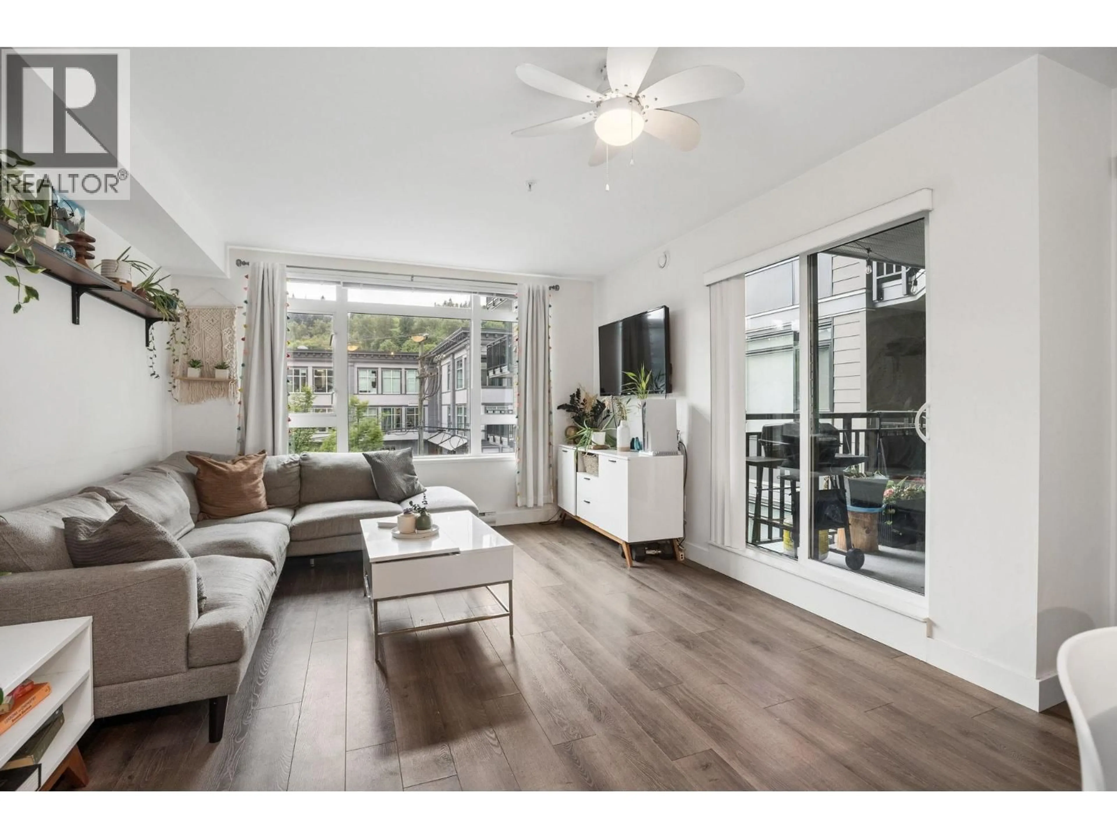 Living room with furniture, wood/laminate floor for 302 - 2525 CLARKE STREET, Port Moody British Columbia V3H0J3