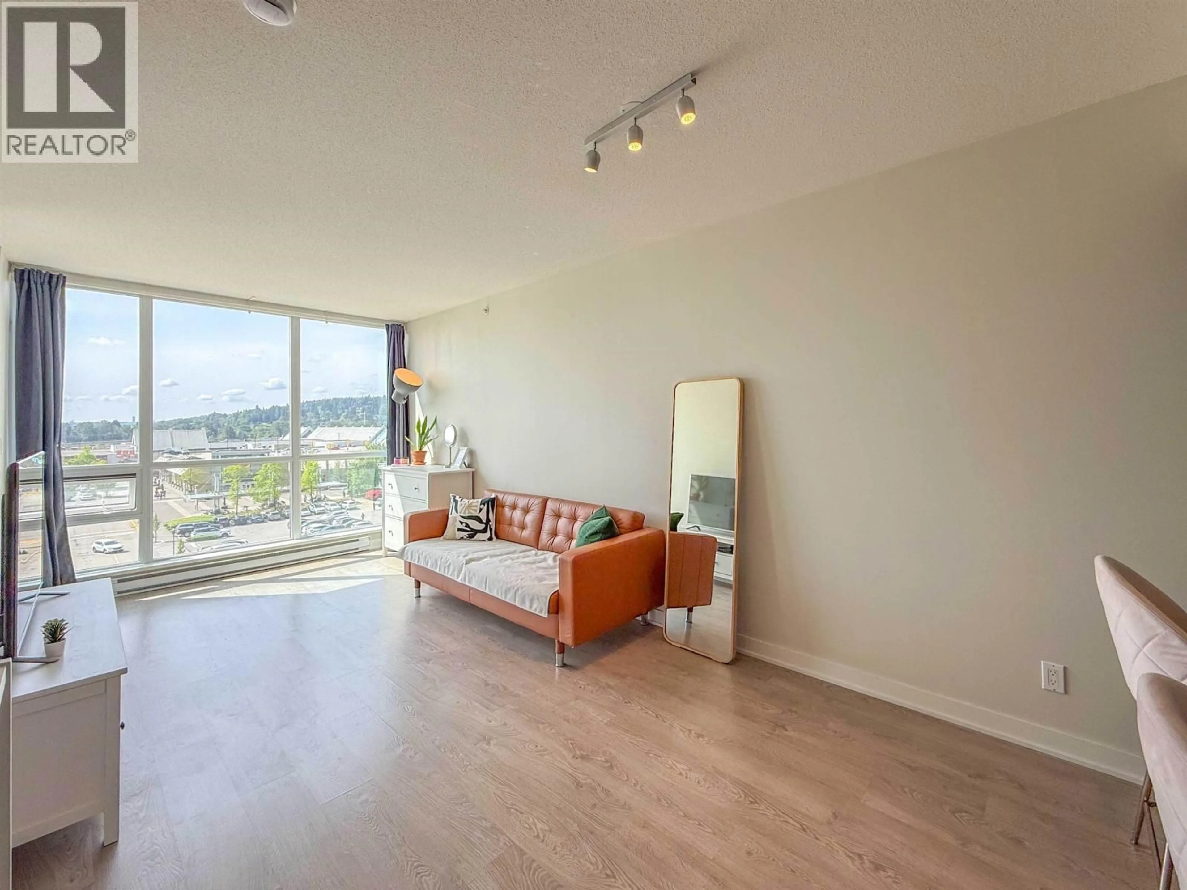 Living room with furniture, wood/laminate floor for 705 - 2975 ATLANTIC AVENUE, Coquitlam British Columbia V3B0C5