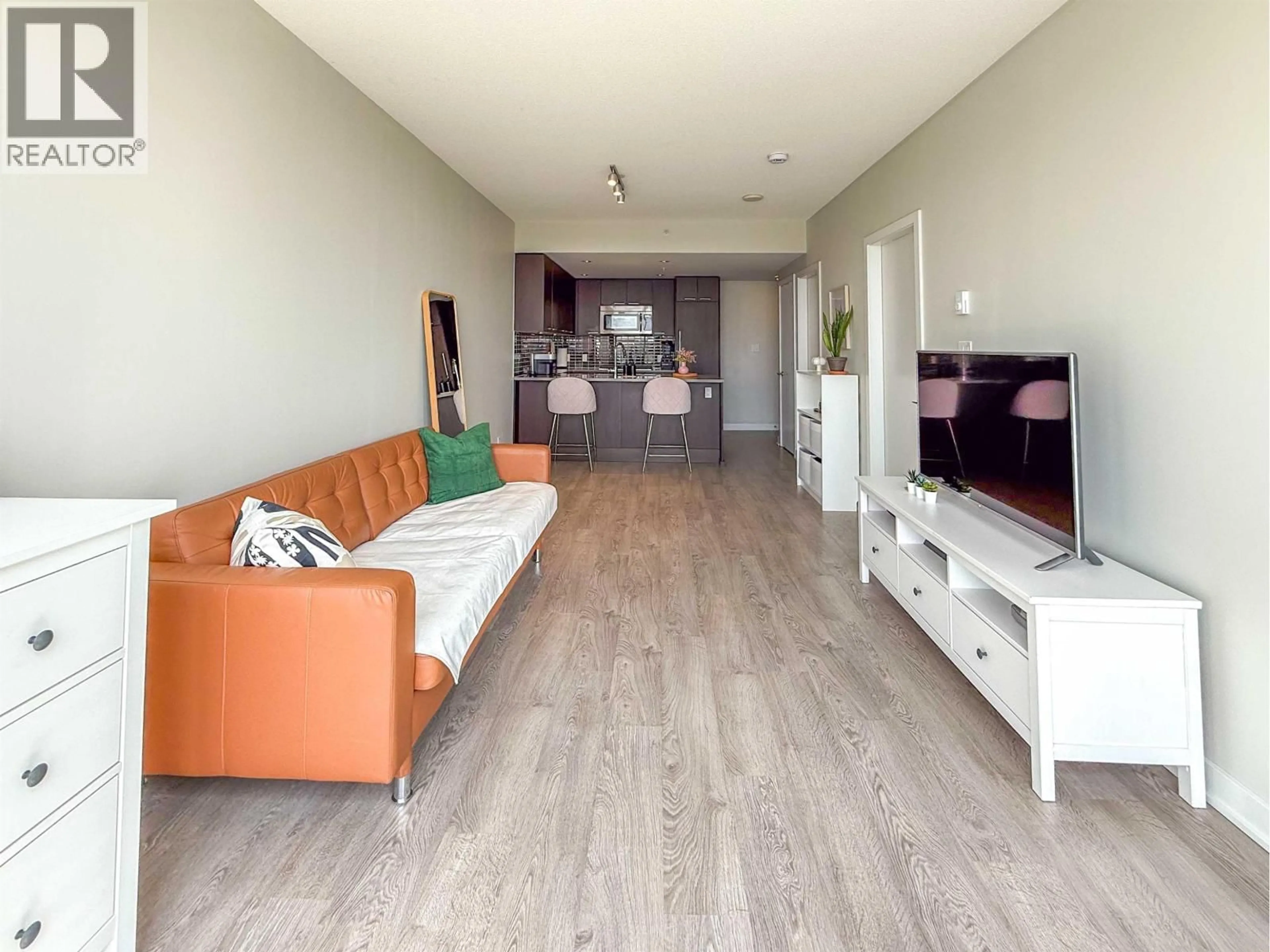 Living room with furniture, wood/laminate floor for 705 - 2975 ATLANTIC AVENUE, Coquitlam British Columbia V3B0C5