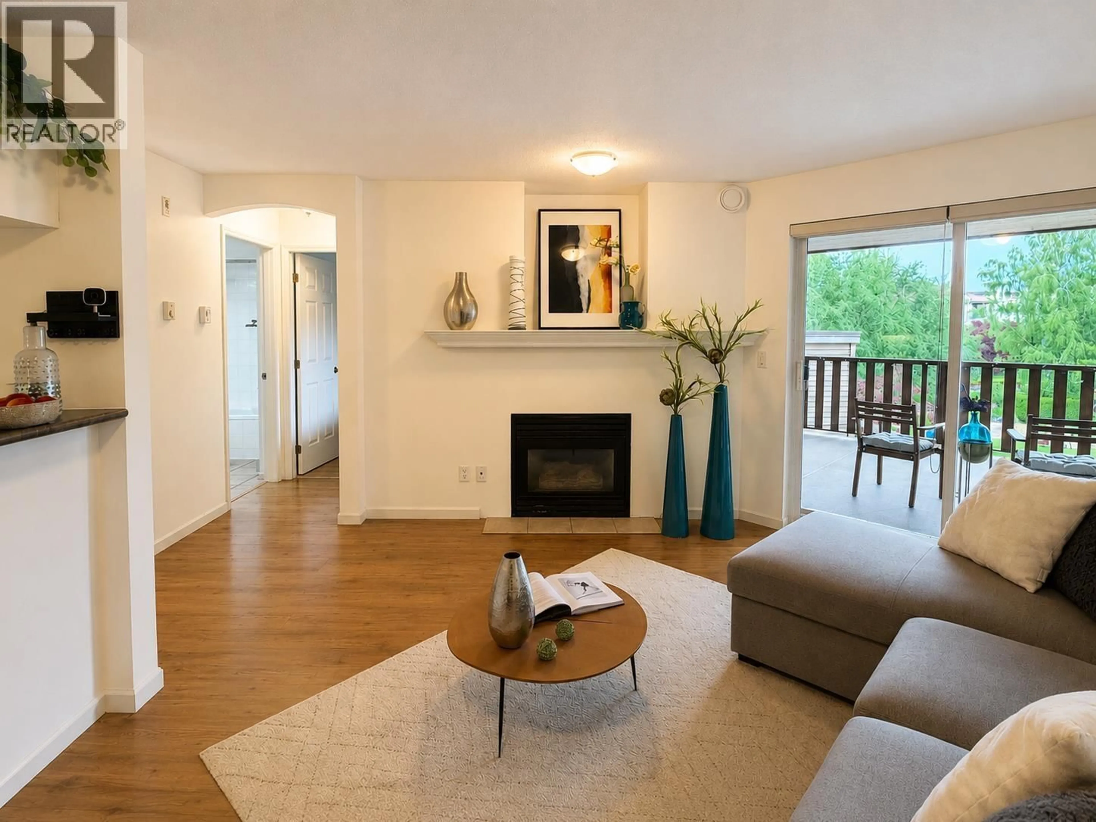 Living room with furniture, wood/laminate floor for 323 - 5600 ANDREWS ROAD, Richmond British Columbia V7E6N1