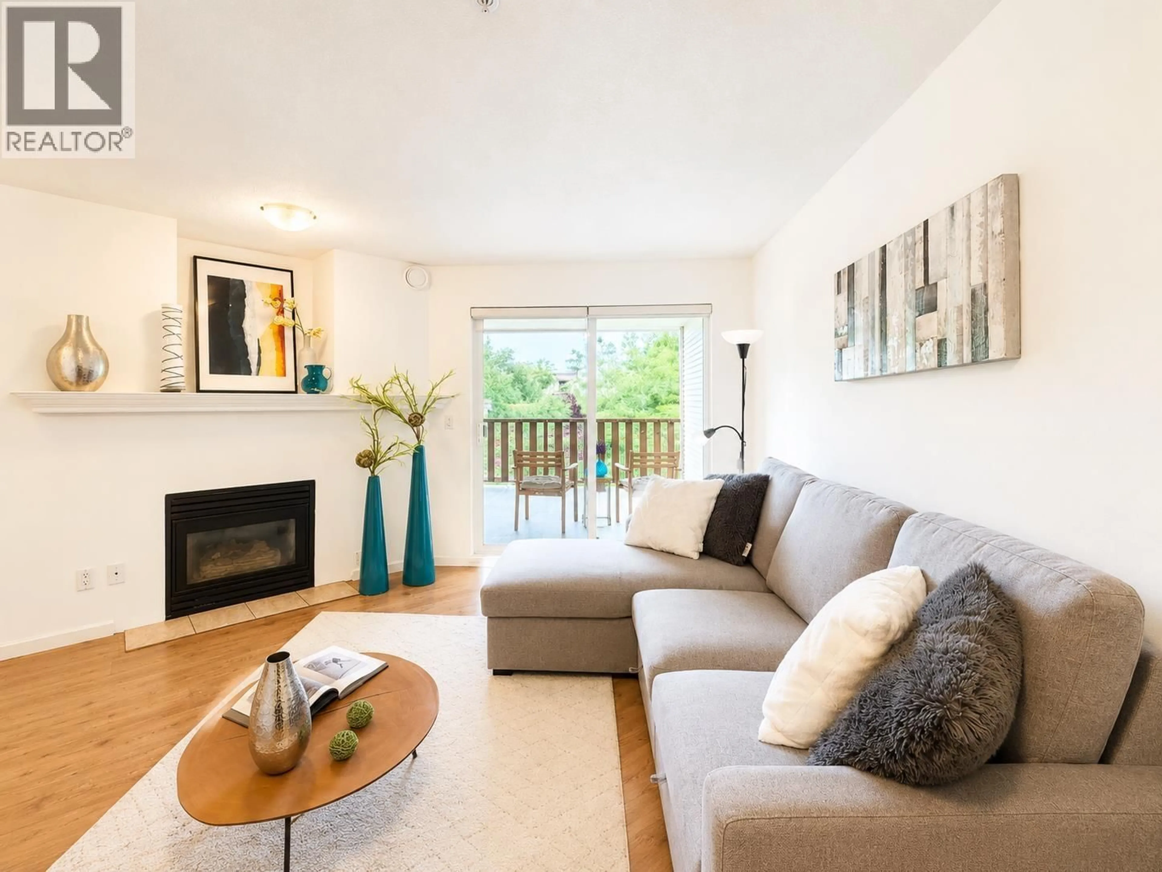 Living room with furniture, wood/laminate floor for 323 - 5600 ANDREWS ROAD, Richmond British Columbia V7E6N1