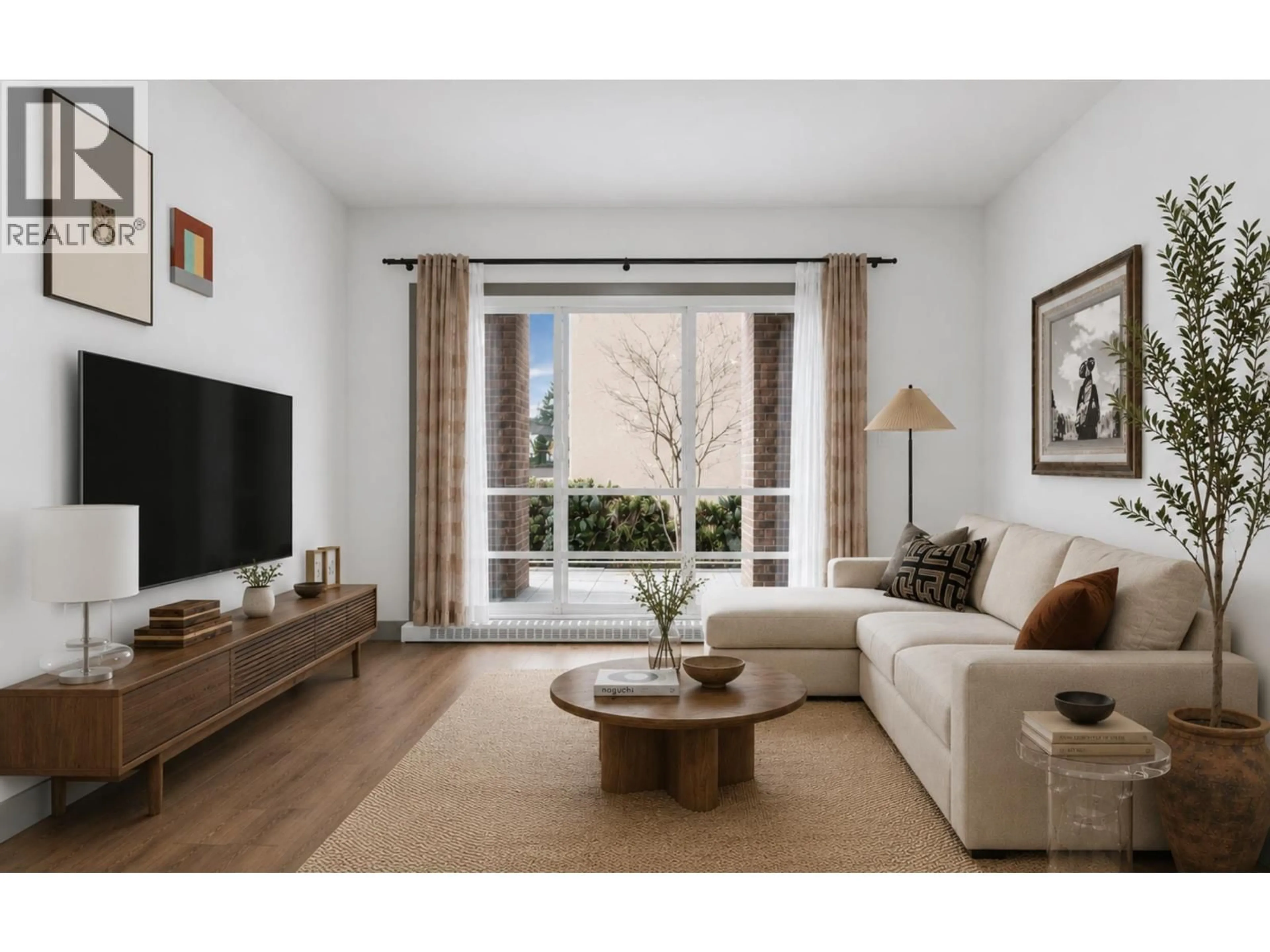 Living room with furniture, wood/laminate floor for 103 - 6875 DUNBLANE AVENUE, Burnaby British Columbia V5J0G6