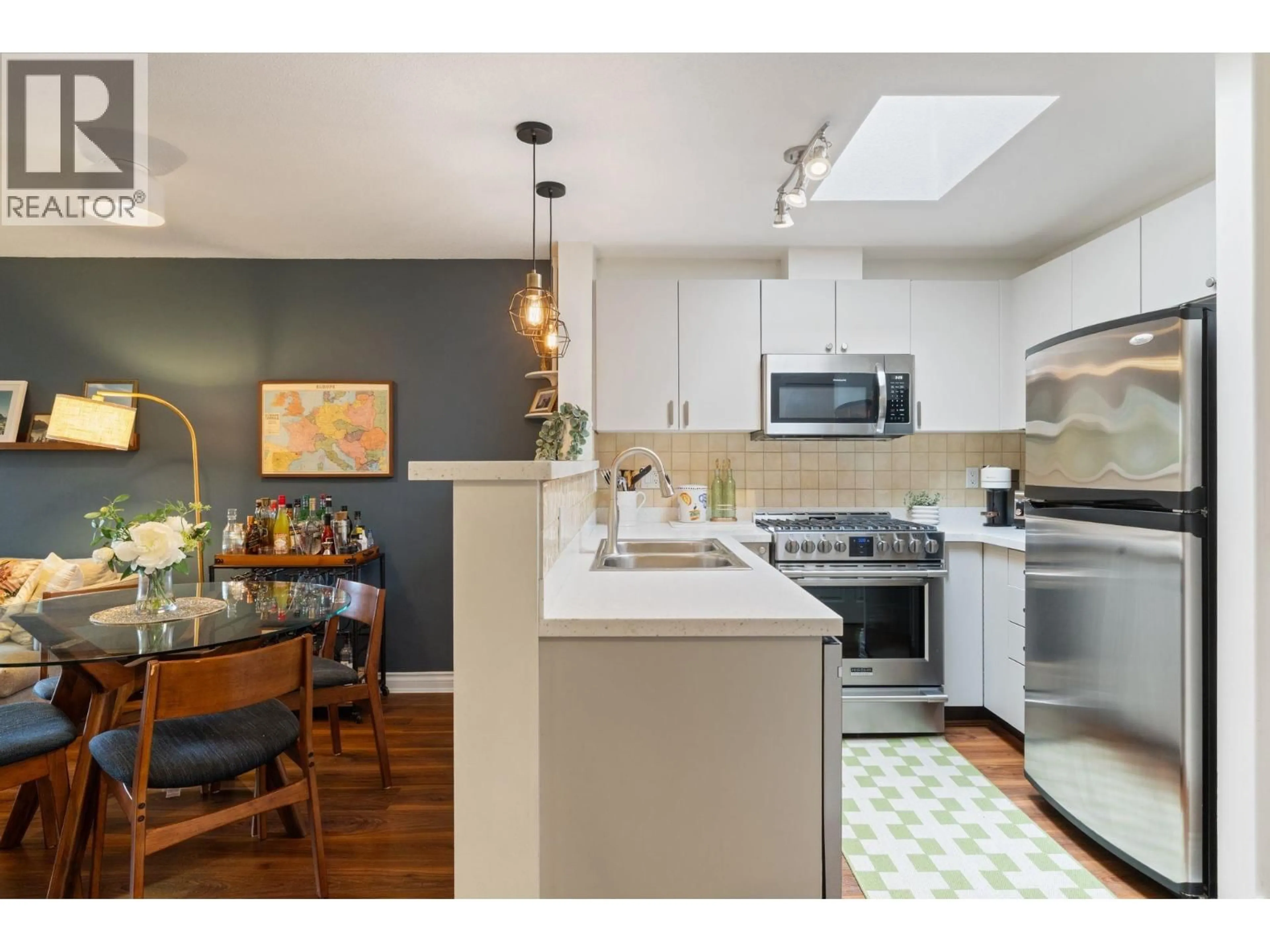 Open concept kitchen, wood/laminate floor for 404 - 2741 HASTINGS STREET, Vancouver British Columbia V5K1Z8