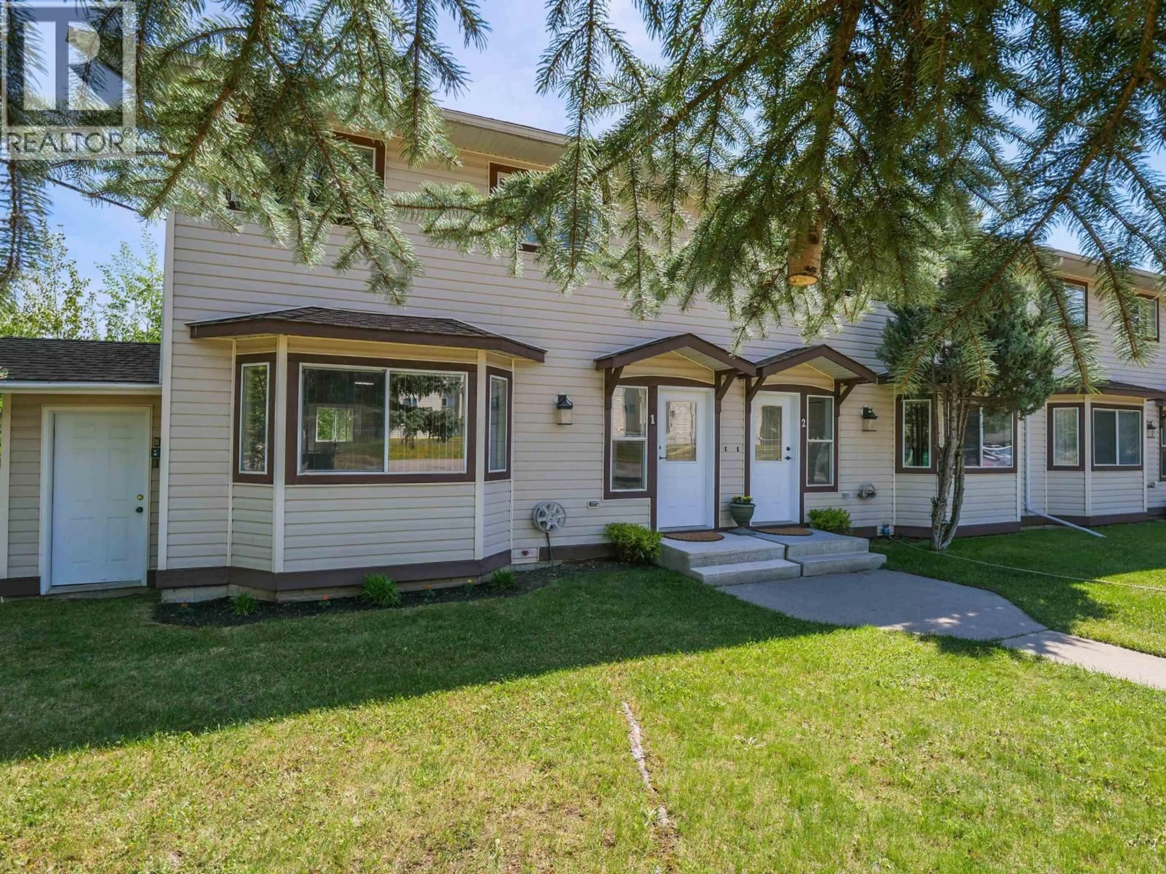 Home with vinyl exterior material, street for 1 - 410 PINCHBECK STREET, Quesnel British Columbia V2J6A3
