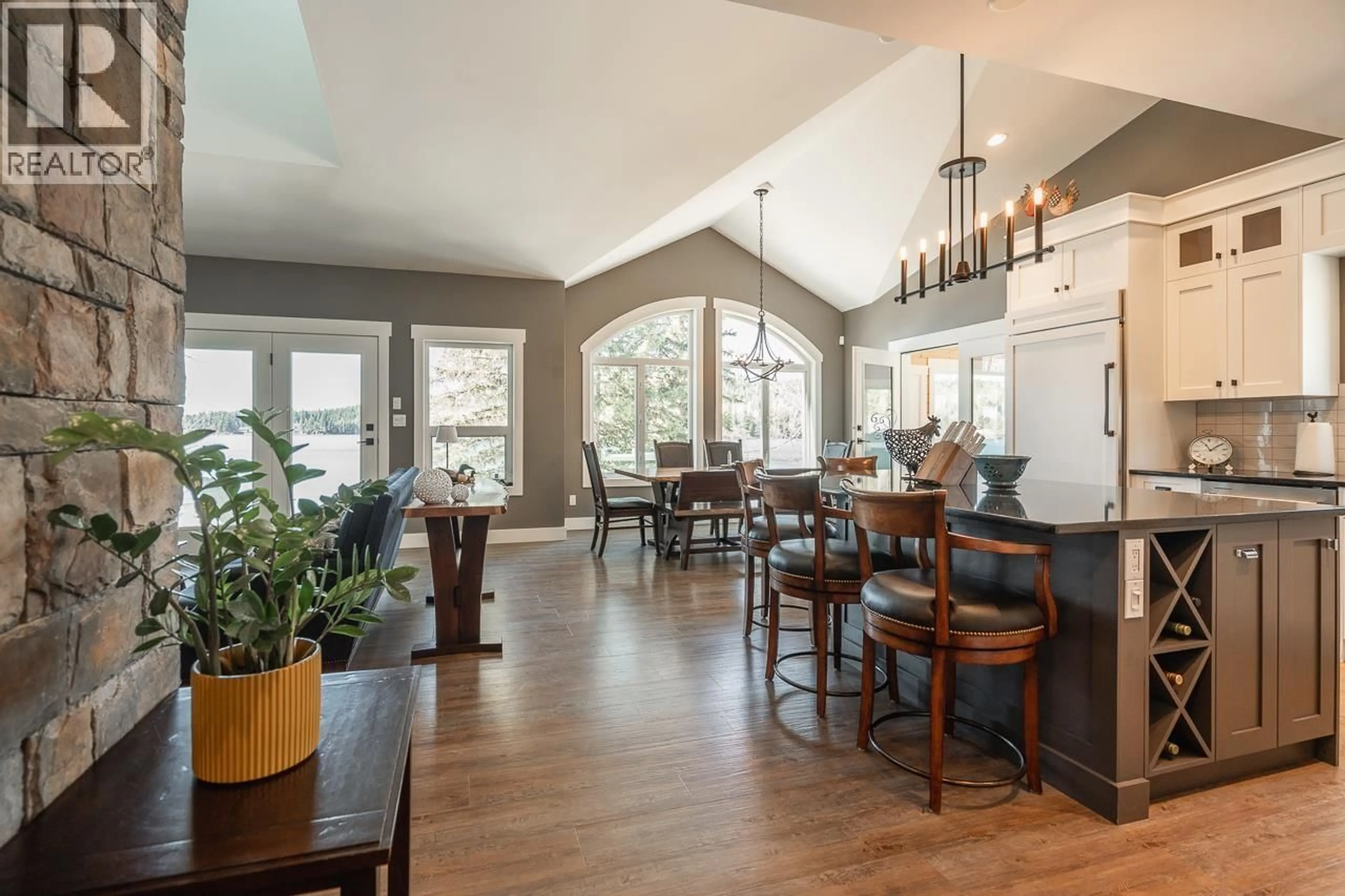 Open concept kitchen, wood/laminate floor for 7922 DEAN ROAD, Bridge Lake British Columbia V0K1X2
