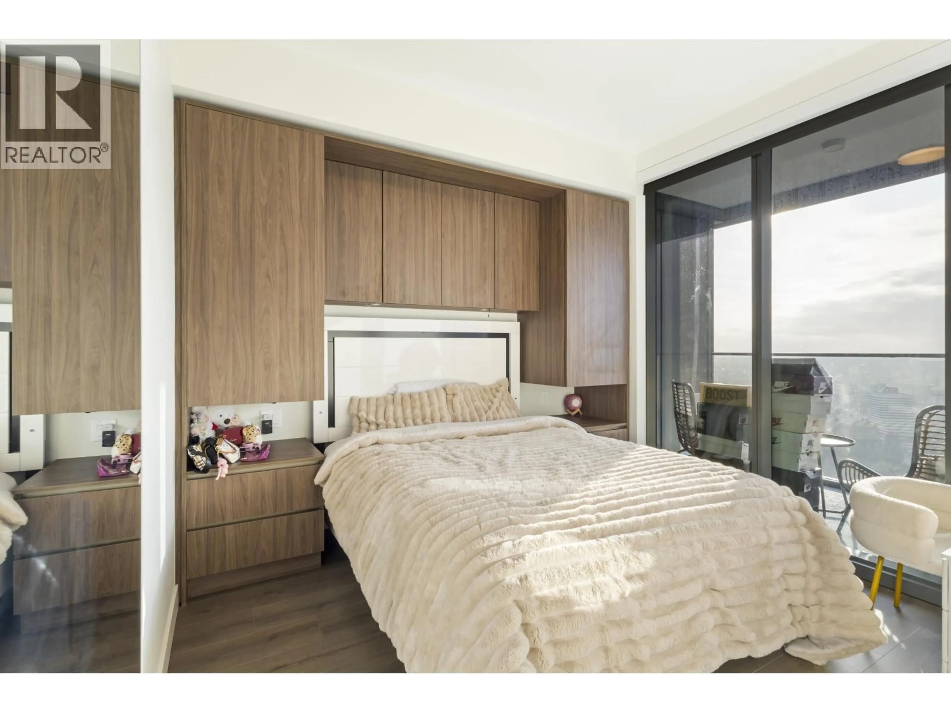 Bedroom with bed, wood/laminate floor for 3905 - 5987 WILSON AVENUE, Burnaby British Columbia V5H0L7