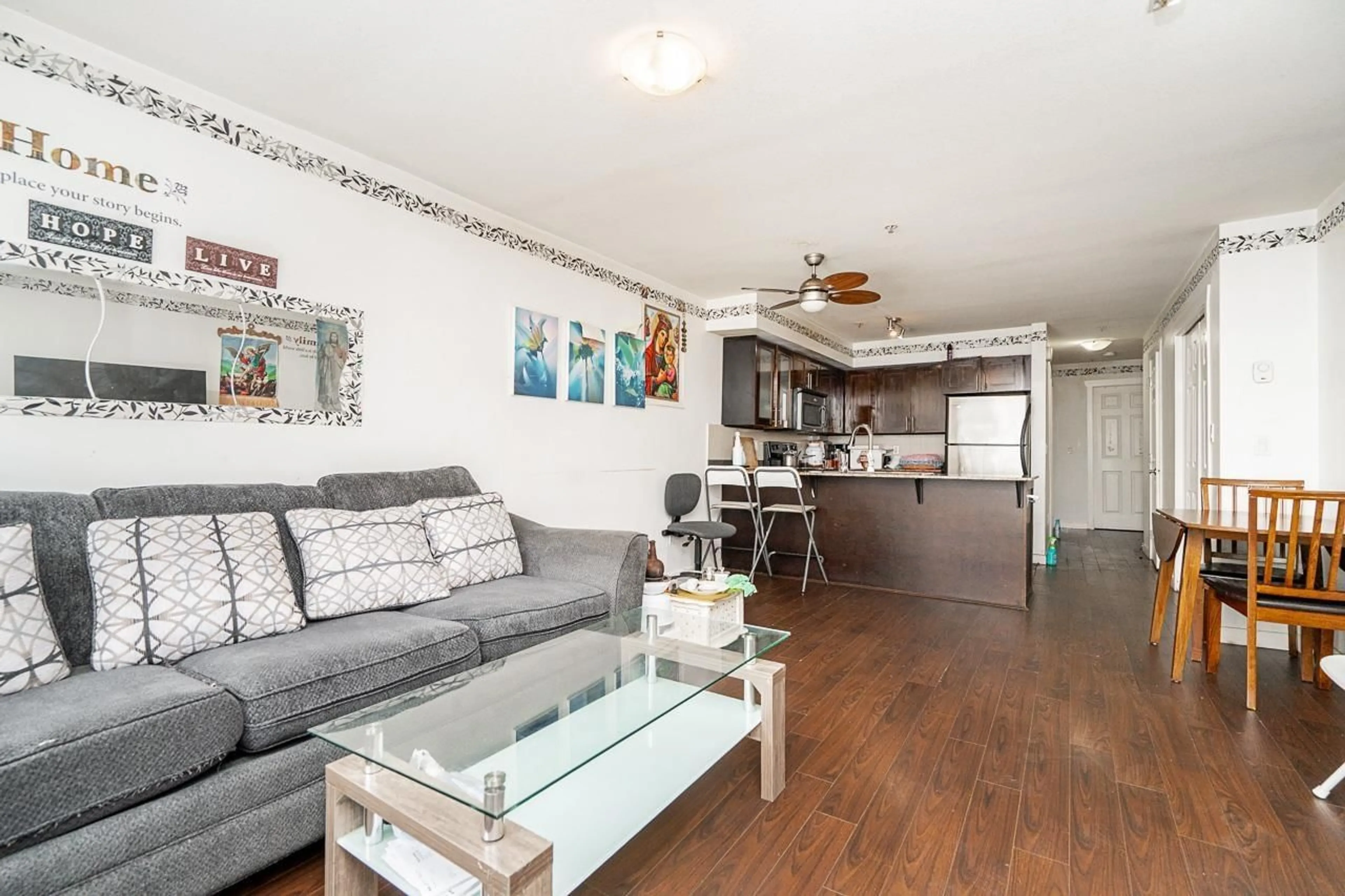 Living room with furniture, wood/laminate floor for 103 - 13958 108 AVENUE, Surrey British Columbia V3T0B4