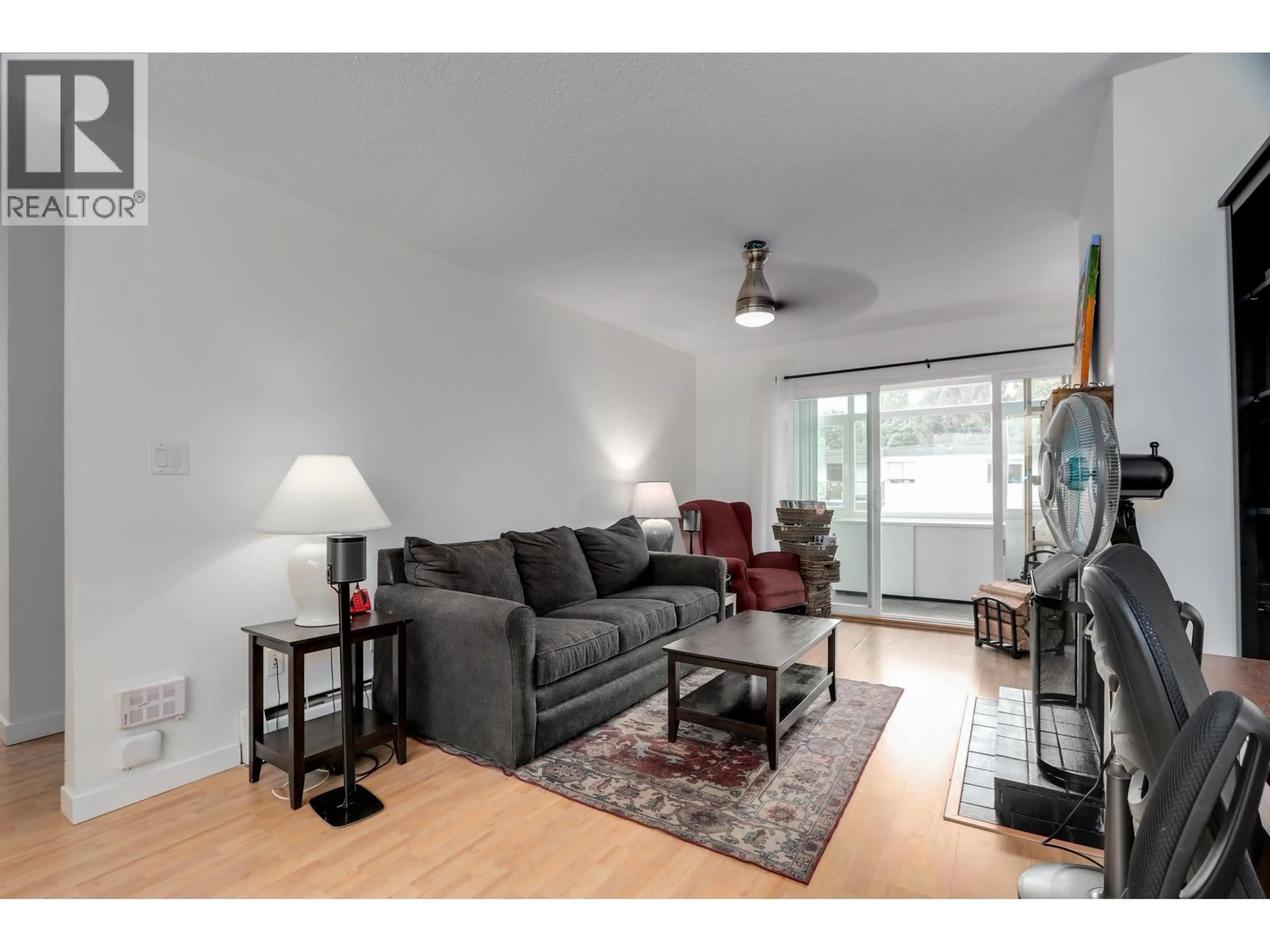 Living room with furniture, wood/laminate floor for 311 - 1420 8TH AVENUE, Vancouver British Columbia V5N1T4