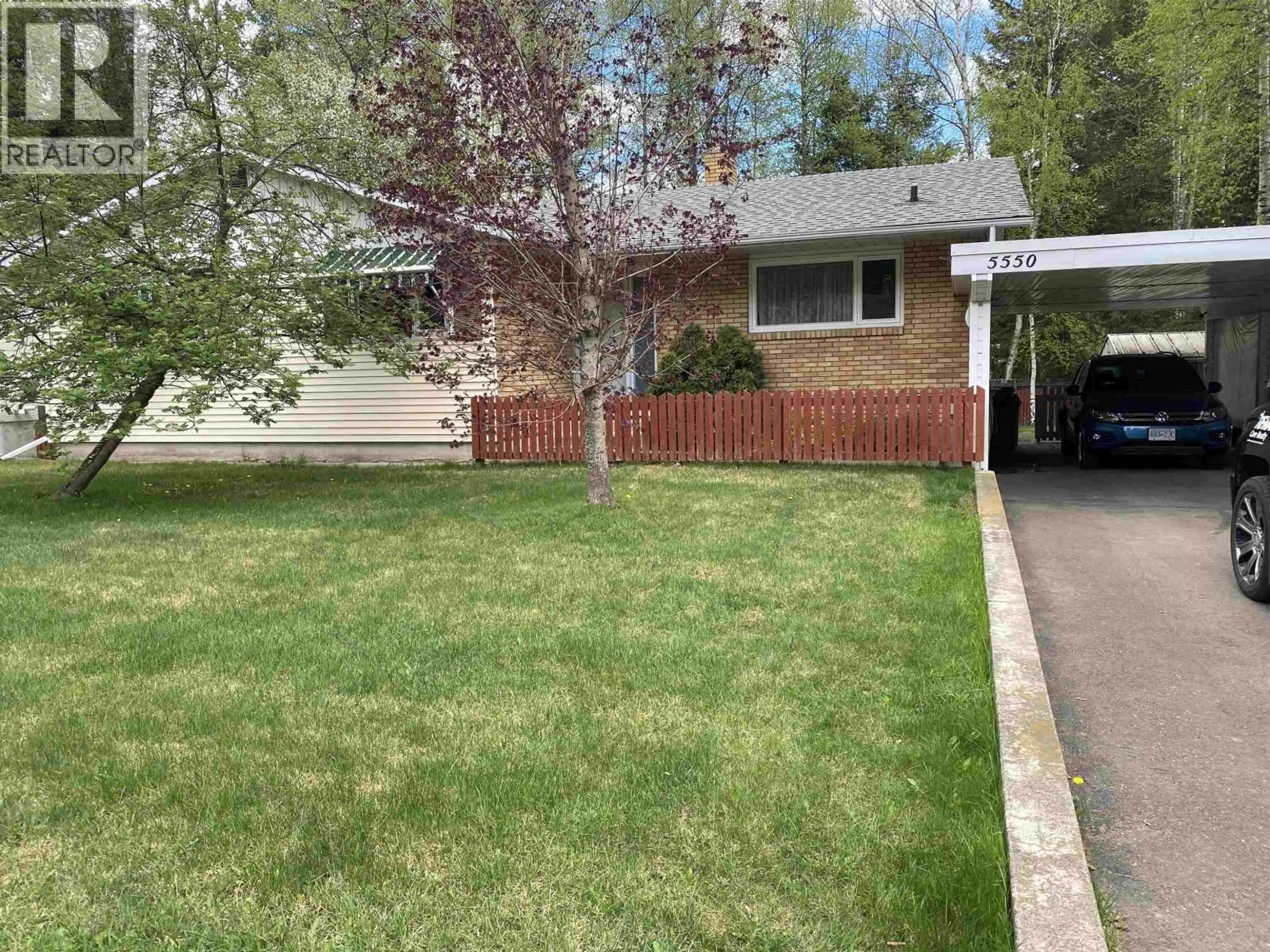 Home with vinyl exterior material, street for 5550 SIMON FRASER AVENUE, Prince George British Columbia V2N2C2