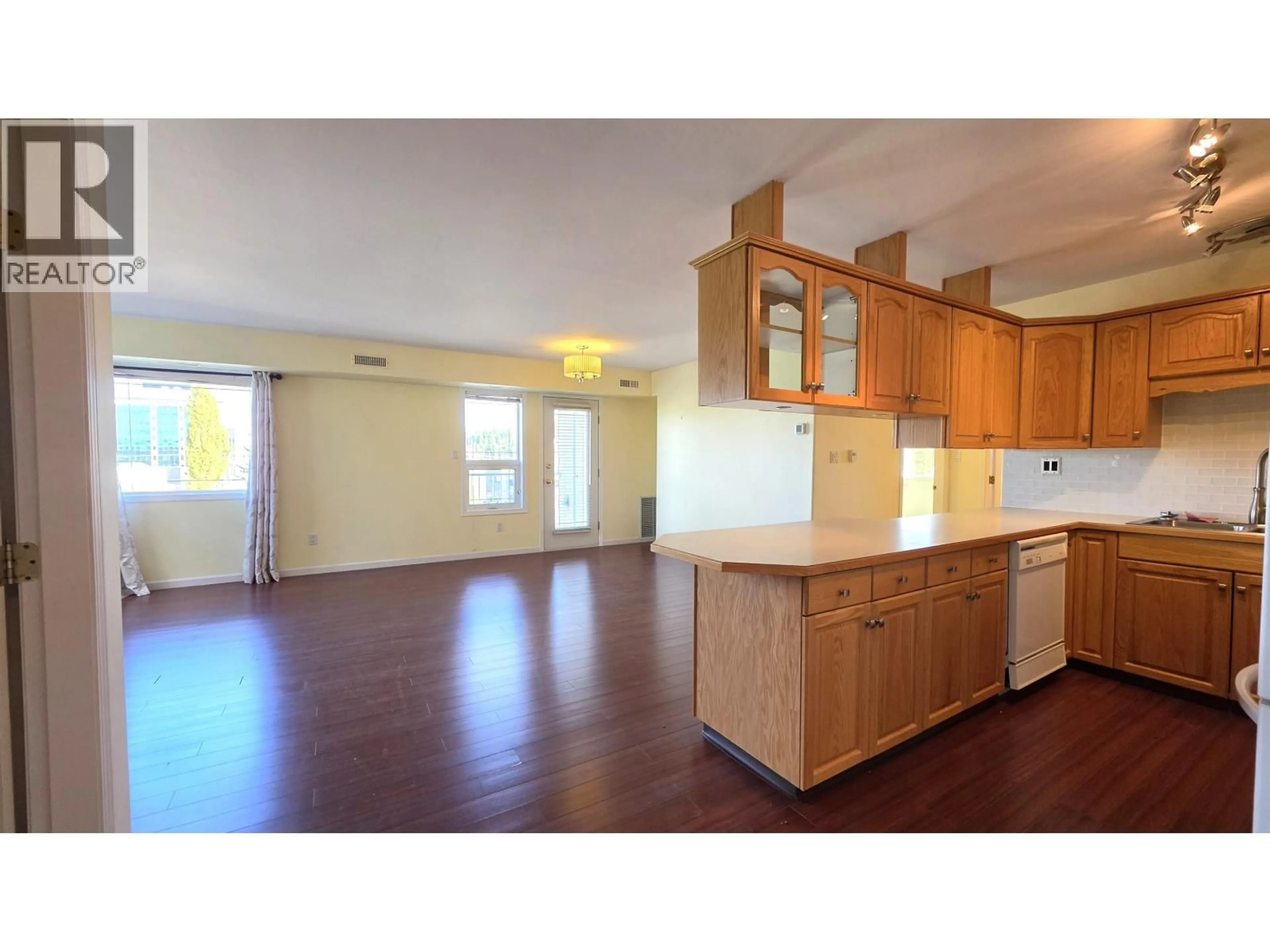 Open concept kitchen, wood/laminate floor for 301 - 1693 6TH AVENUE, Prince George British Columbia V2L3N5