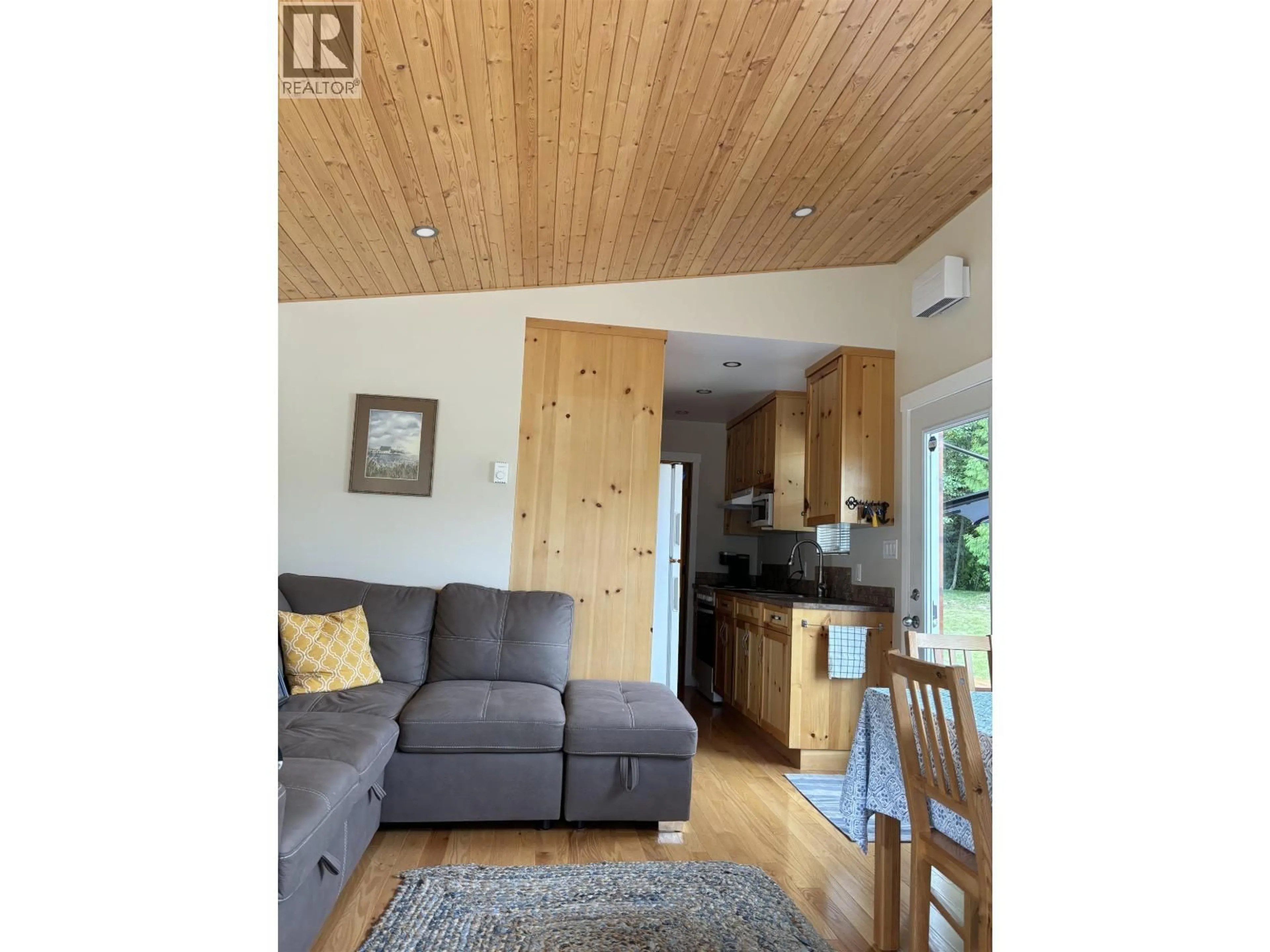 Living room with furniture, wood/laminate floor for 1440 WESTSIDE ROAD, Lakelse Lake British Columbia V8G4B8