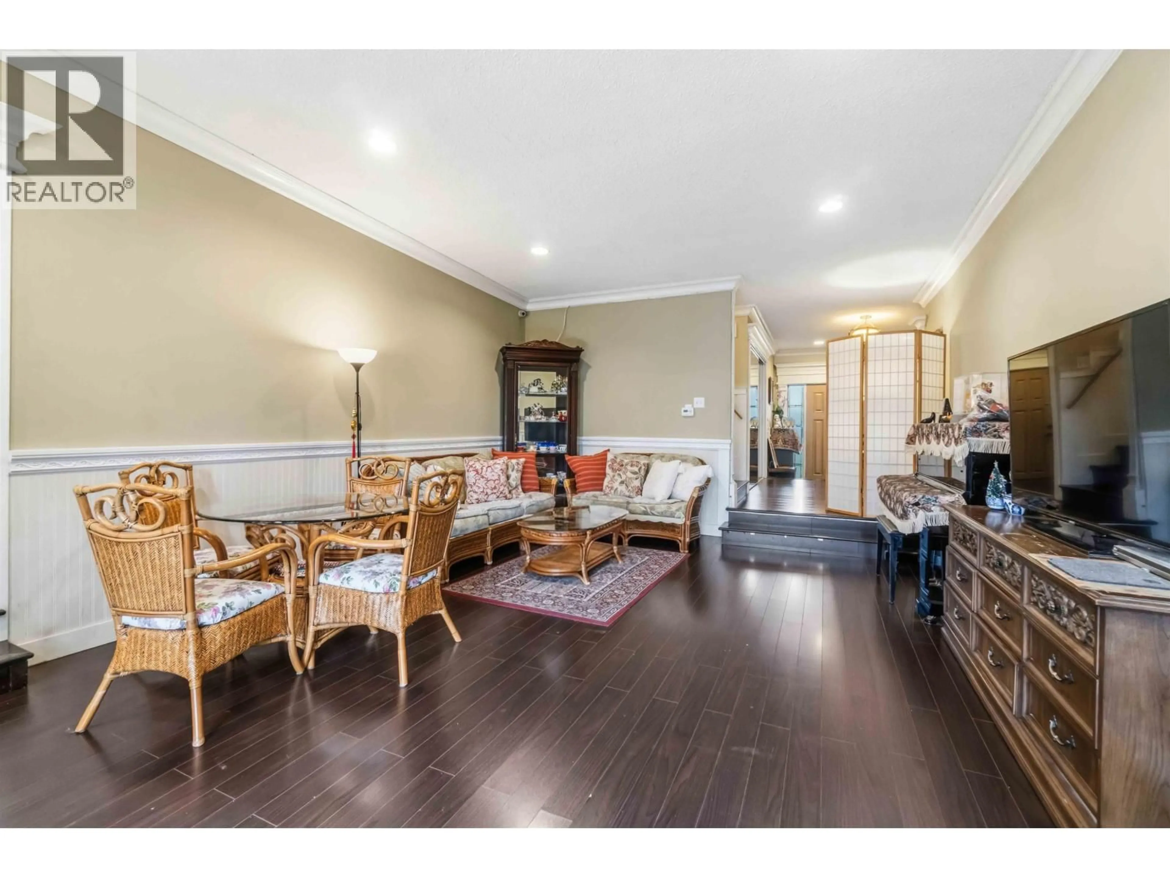 Living room with furniture, wood/laminate floor for 6389 FREMLIN STREET, Vancouver British Columbia V5Z3X4