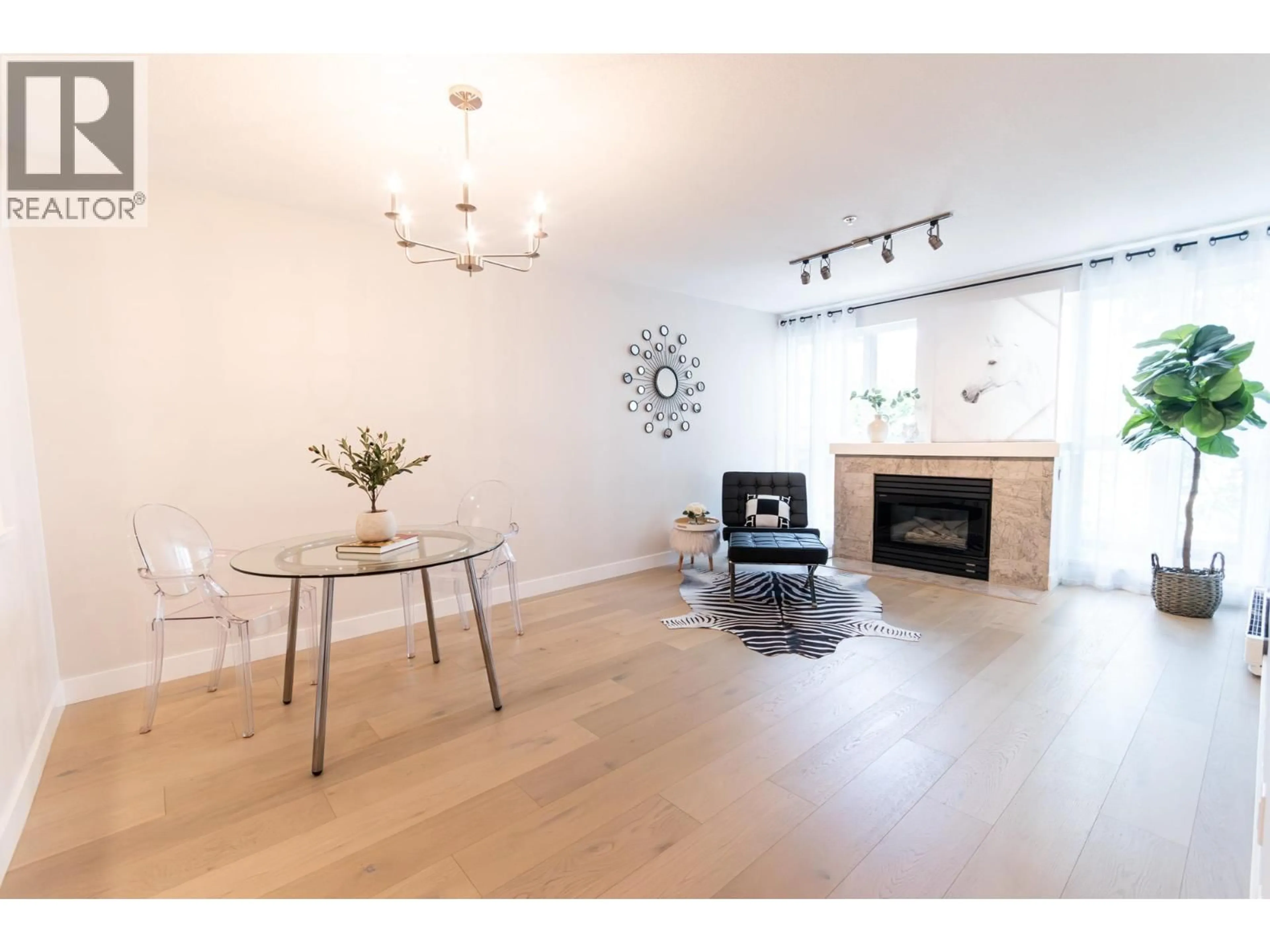Living room with furniture, wood/laminate floor for PH5 - 1163 THE HIGH STREET, Coquitlam British Columbia V3B7W2