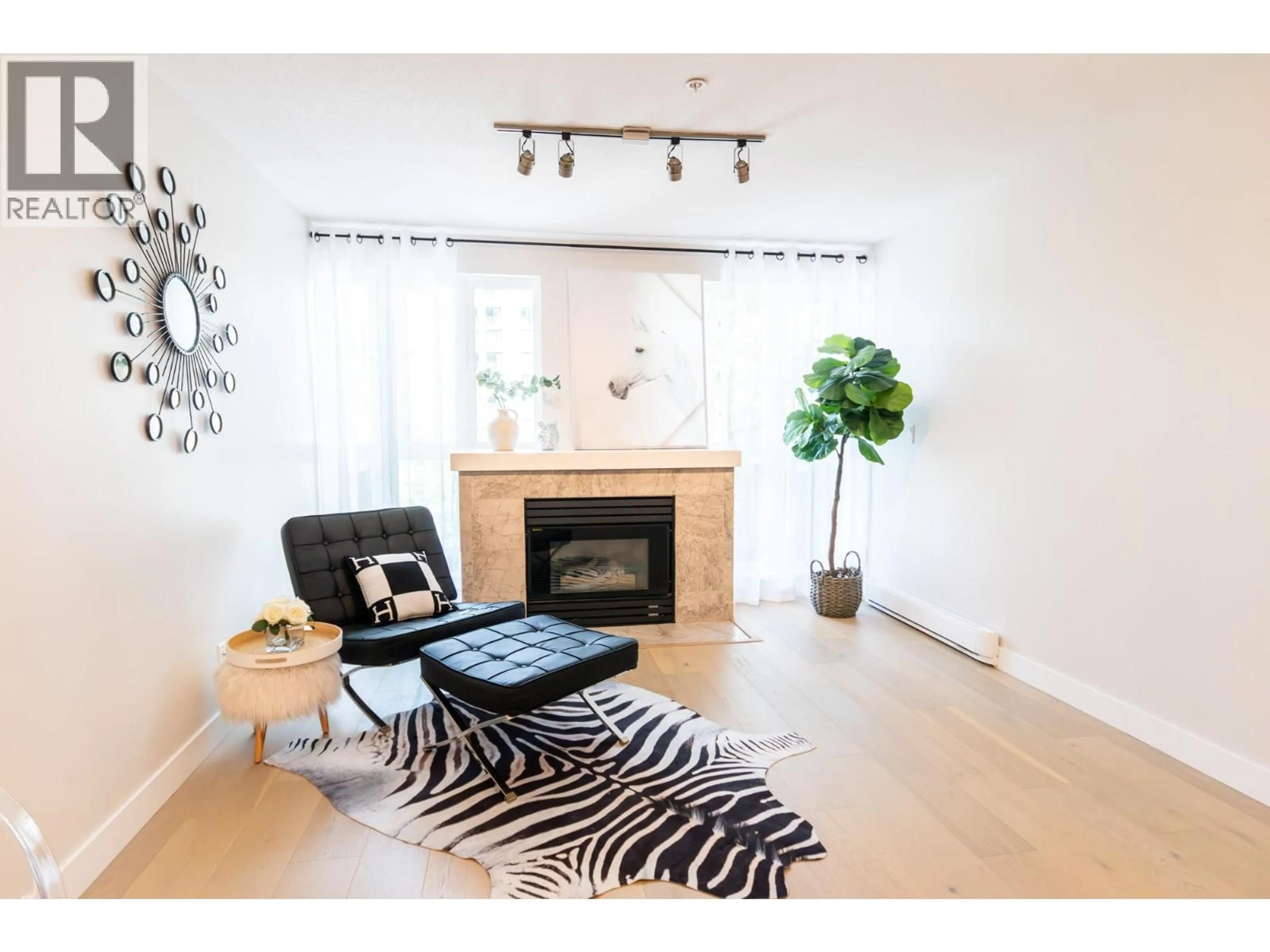 Living room with furniture, wood/laminate floor for PH5 - 1163 THE HIGH STREET, Coquitlam British Columbia V3B7W2