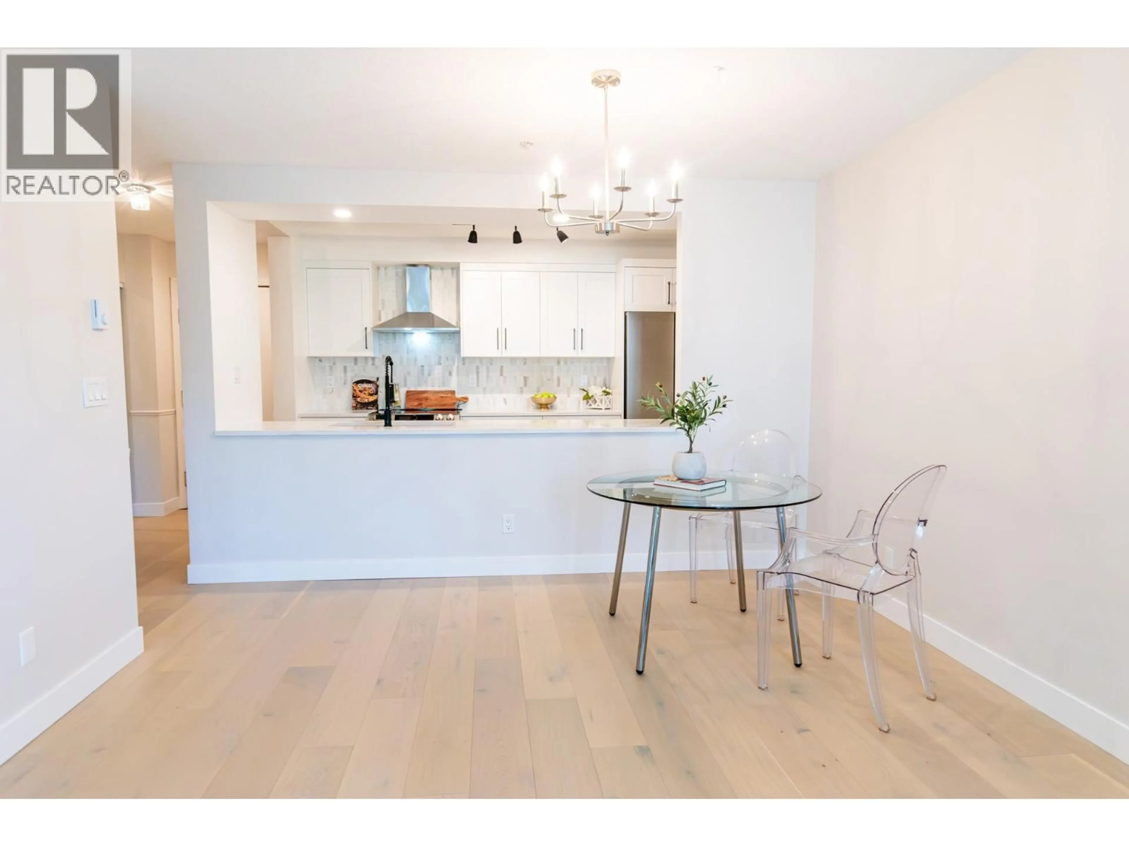 Open concept kitchen, wood/laminate floor for PH5 - 1163 THE HIGH STREET, Coquitlam British Columbia V3B7W2