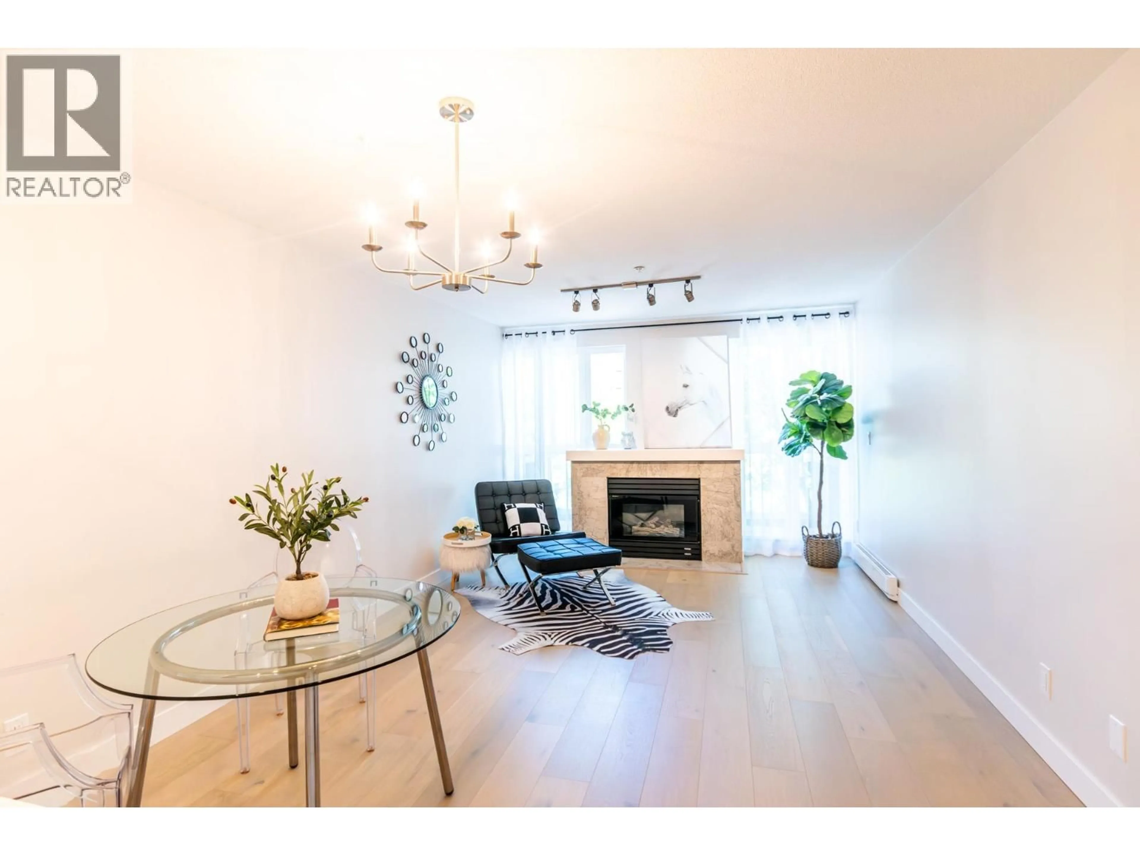 Living room with furniture, wood/laminate floor for PH5 - 1163 THE HIGH STREET, Coquitlam British Columbia V3B7W2