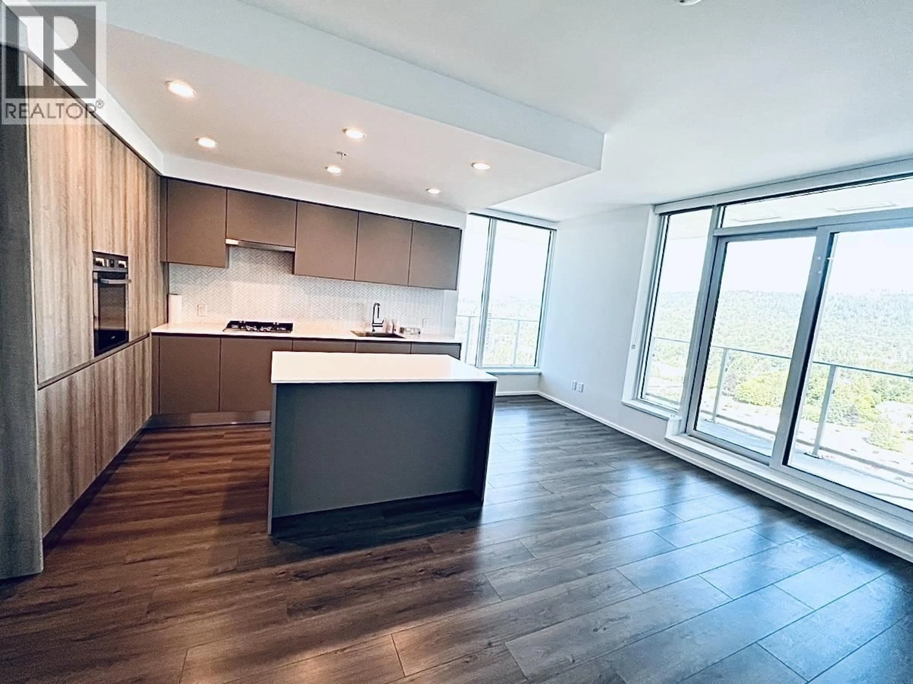 Open concept kitchen, wood/laminate floor for 2510 - 3833 EVERGREEN PLACE, Burnaby British Columbia V3J0M2
