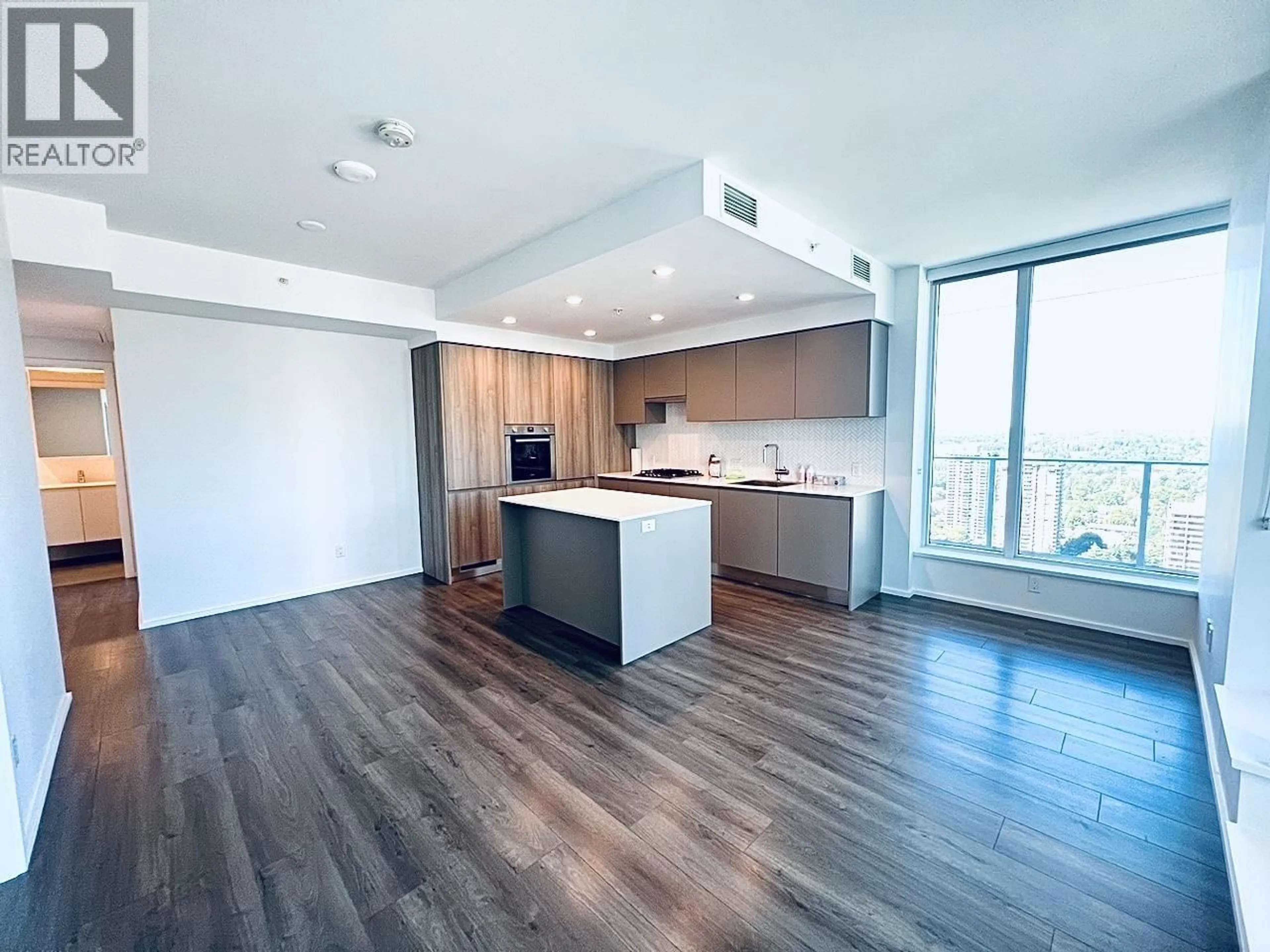 Open concept kitchen, wood/laminate floor for 2510 - 3833 EVERGREEN PLACE, Burnaby British Columbia V3J0M2