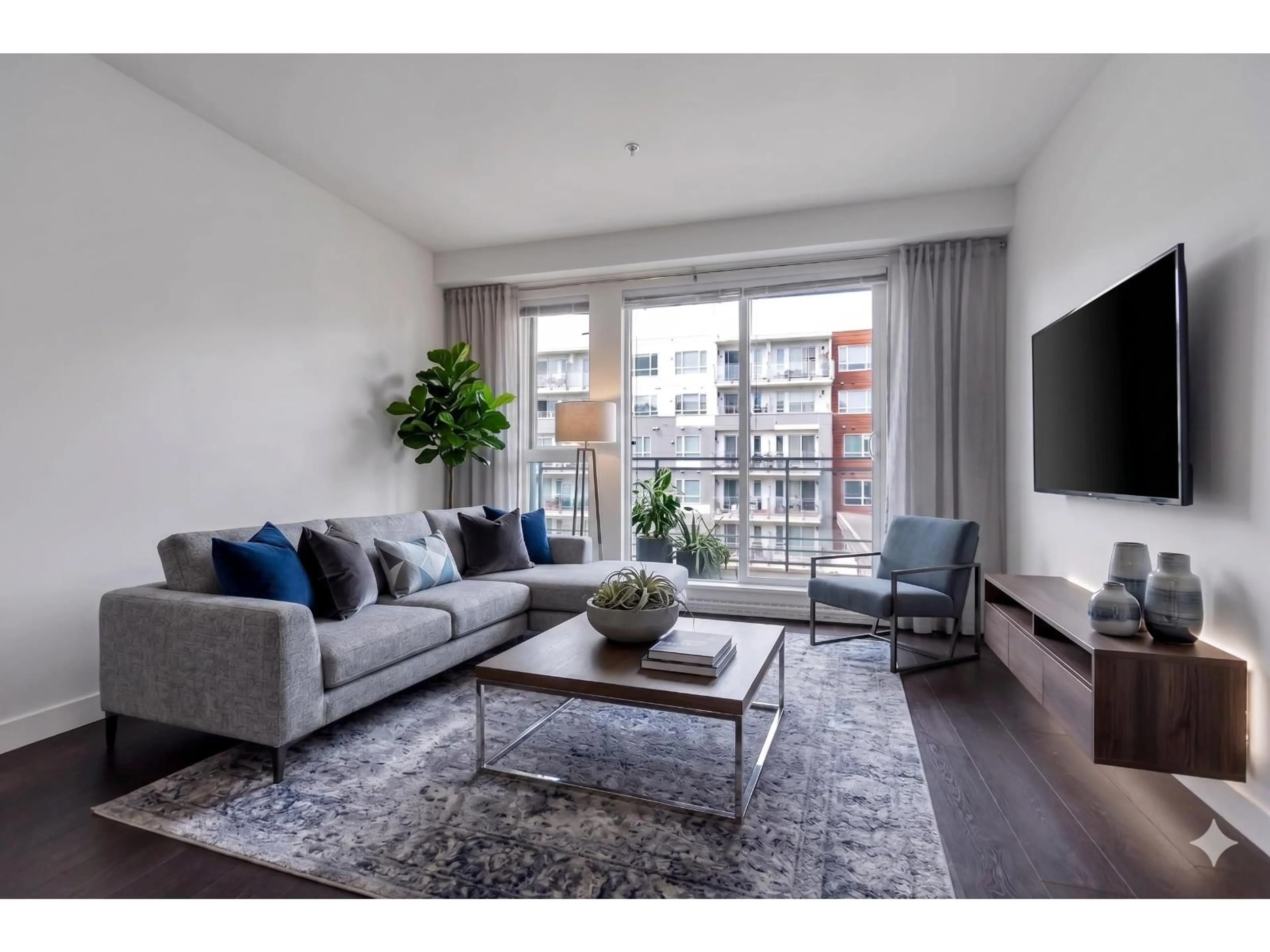 Living room with furniture, wood/laminate floor for 401 - 10581 140 STREET, Surrey British Columbia V3T0M7