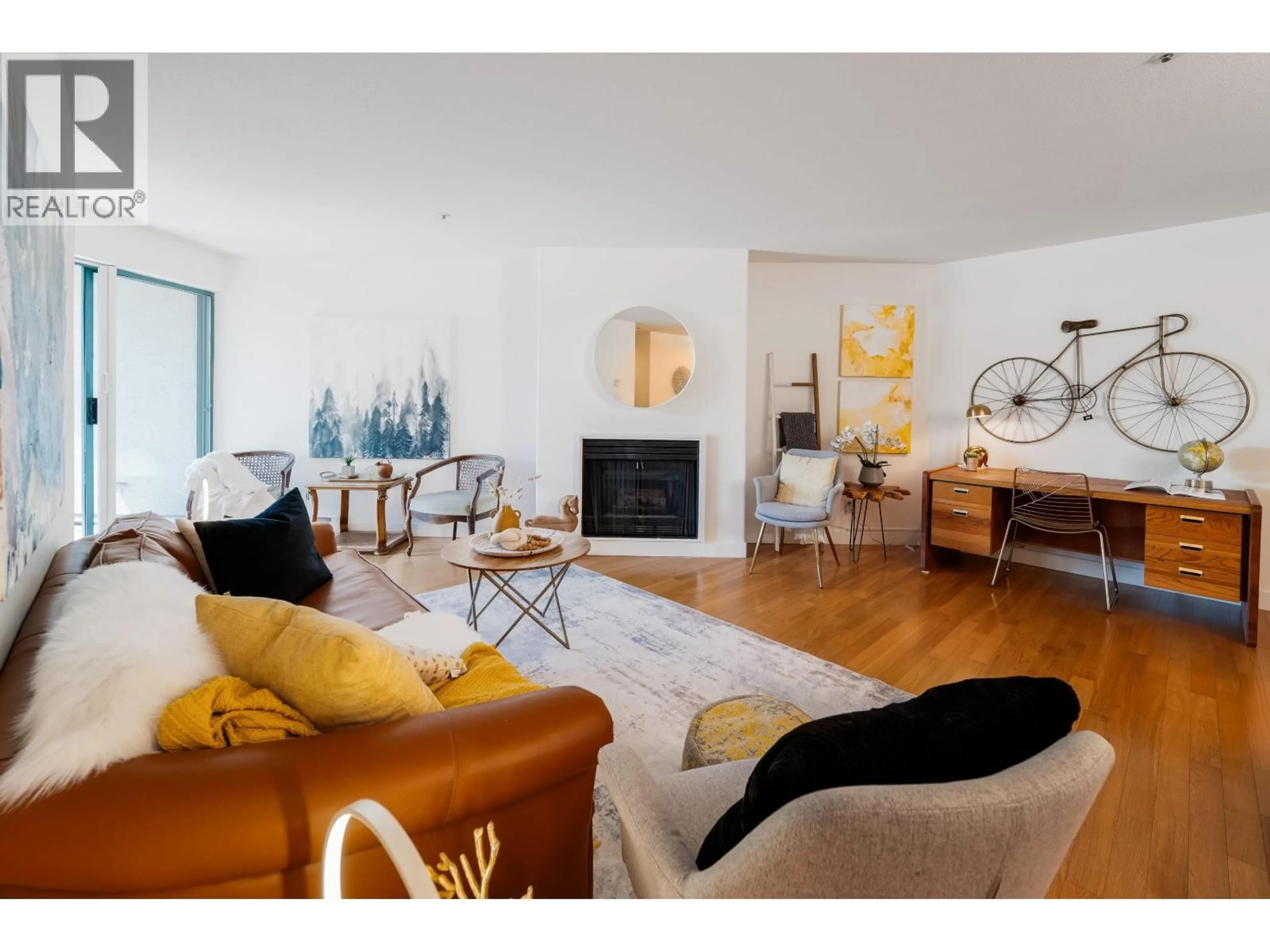 Living room with furniture, wood/laminate floor for 209 - 3131 MAIN STREET, Vancouver British Columbia V5T3G8