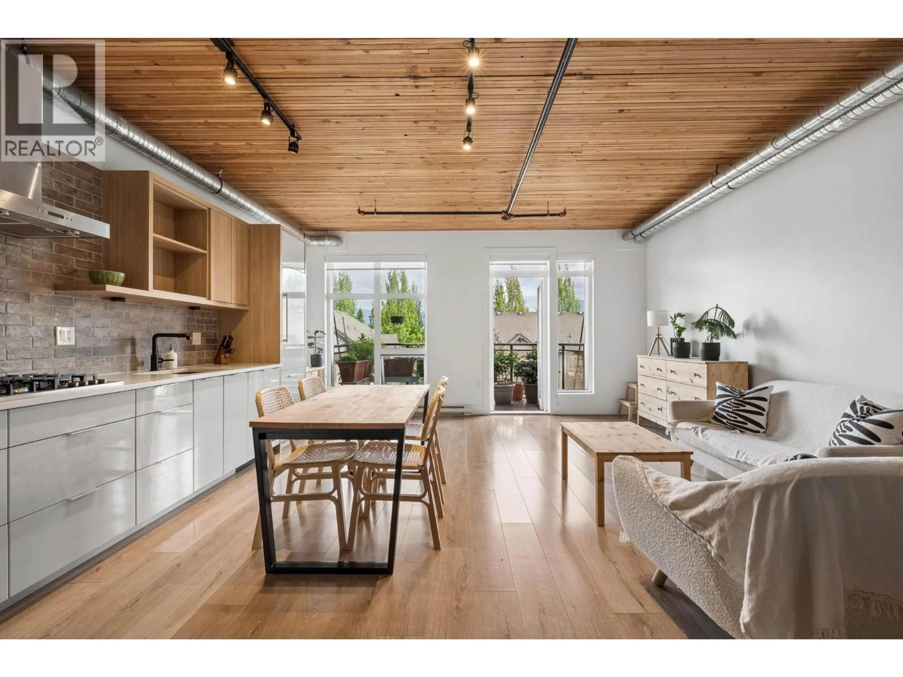 Open concept kitchen, wood/laminate floor for 305 - 4223 HASTINGS STREET, Burnaby British Columbia V5C2J5