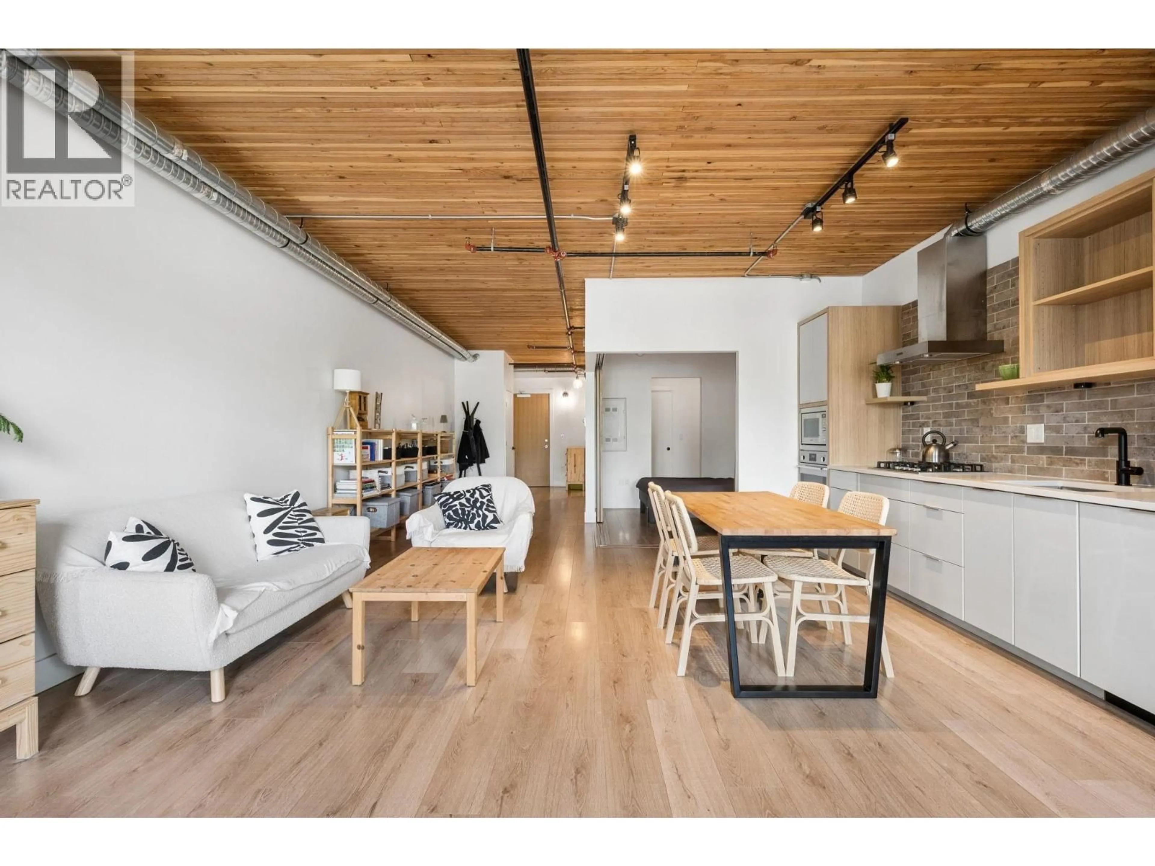 Open concept kitchen, wood/laminate floor for 305 - 4223 HASTINGS STREET, Burnaby British Columbia V5C2J5