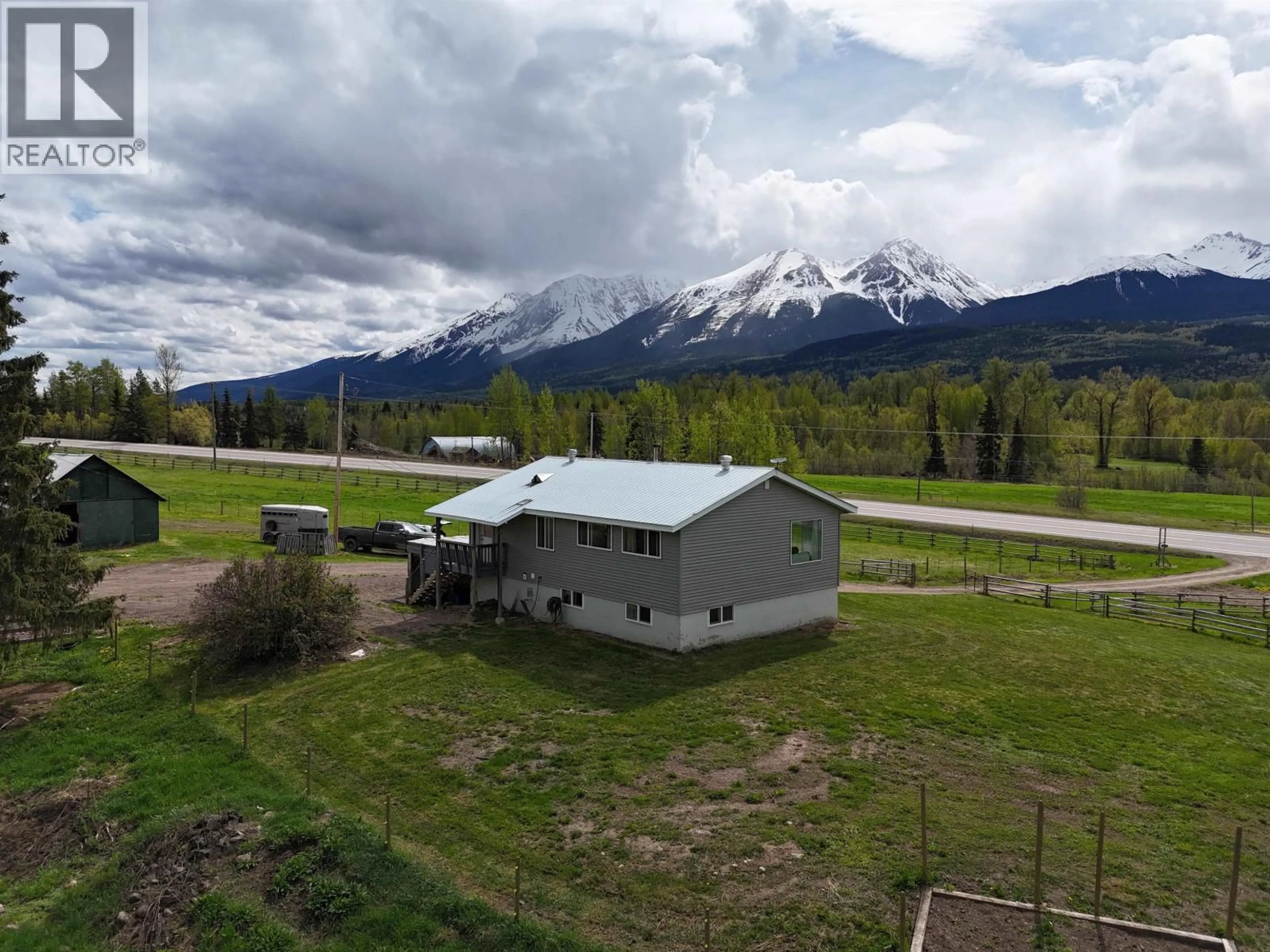 A pic from outside/outdoor area/front of a property/back of a property/a pic from drone, mountain view for 21872 16 HIGHWAY, Smithers British Columbia V0J2N1