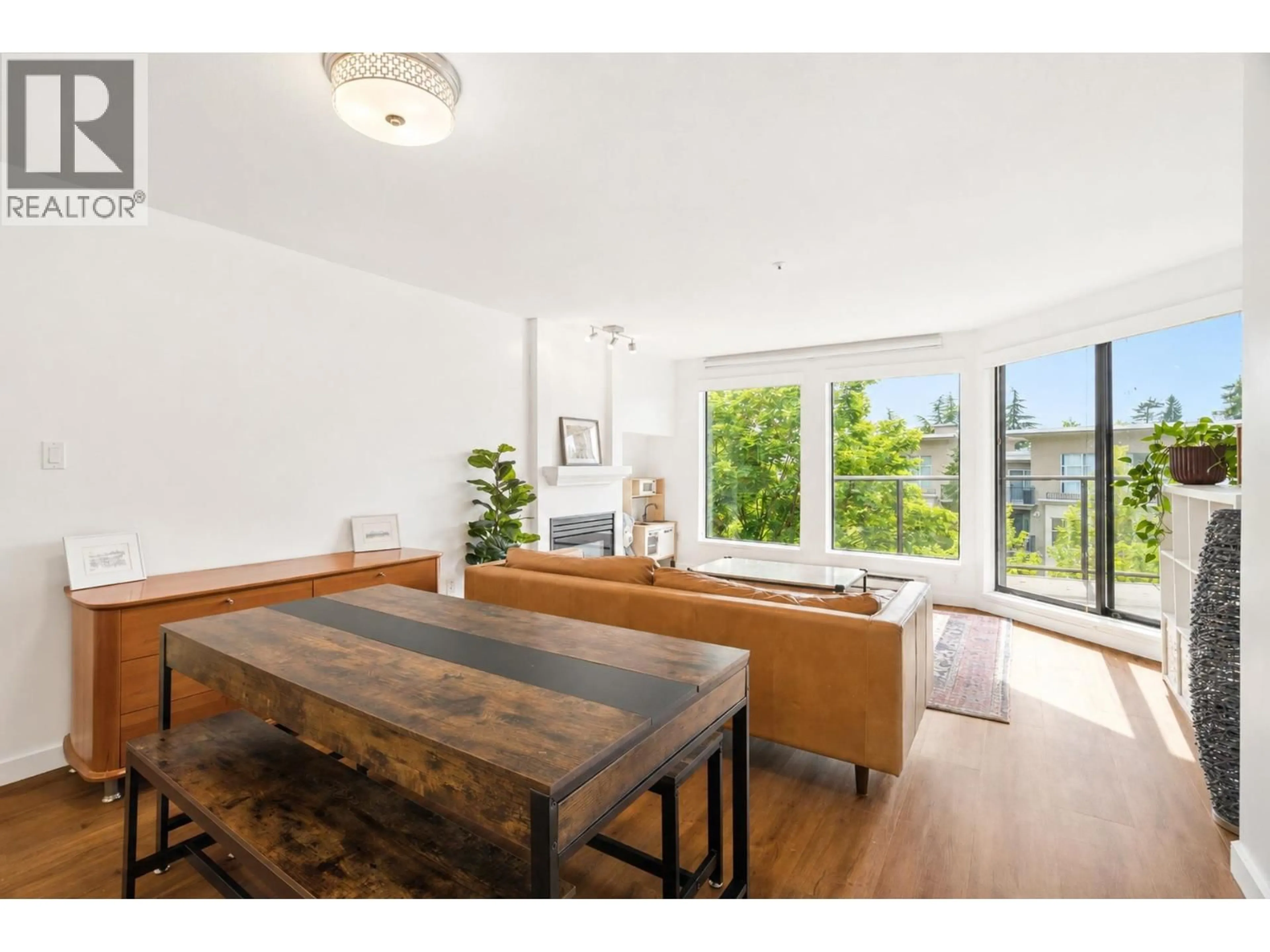 Living room with furniture, wood/laminate floor for 413 - 2968 BURLINGTON DRIVE, Coquitlam British Columbia V3B7N4