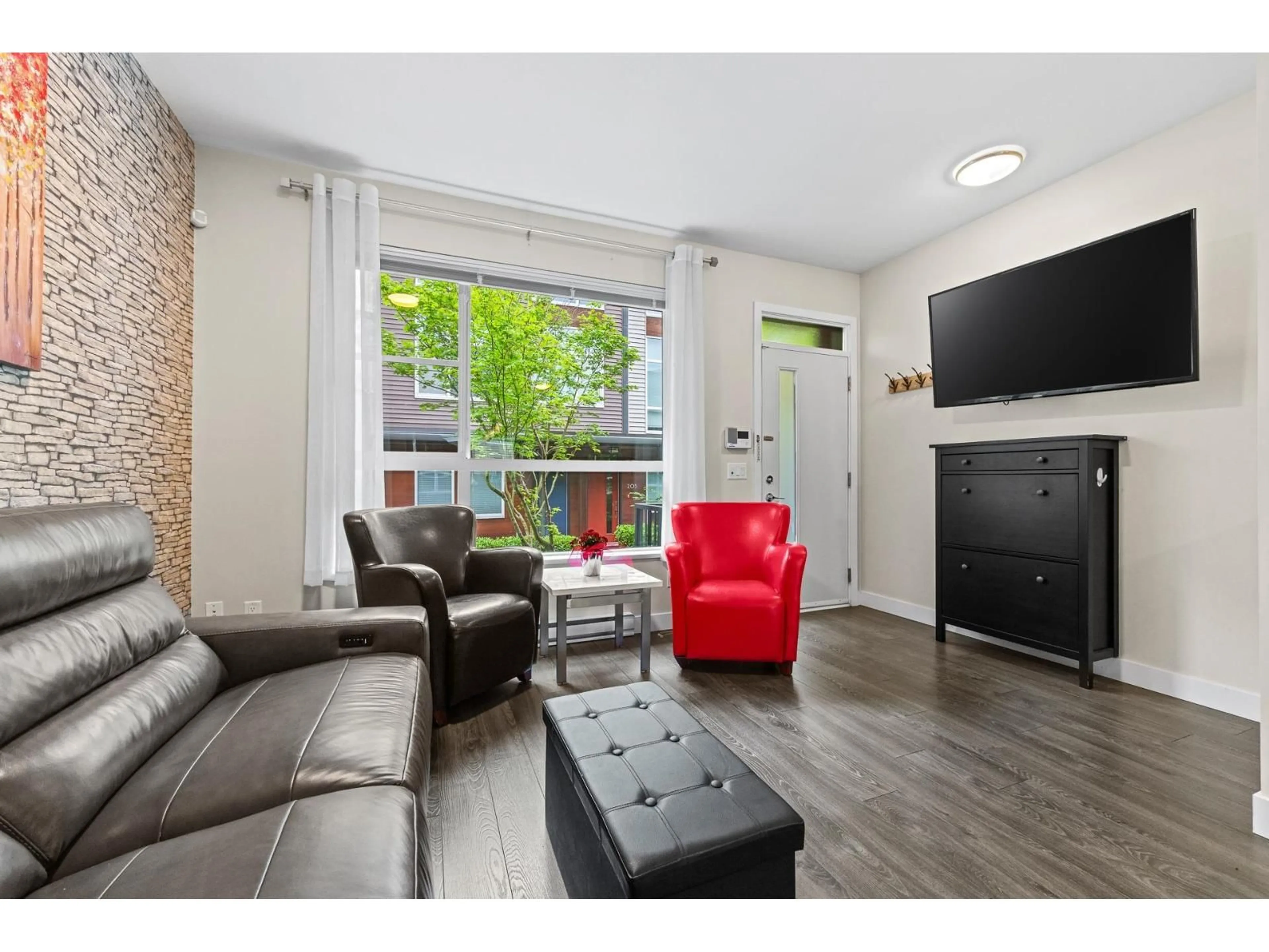 Living room with furniture, wood/laminate floor for 122 - 2228 162 STREET, Surrey British Columbia V3Z6P4