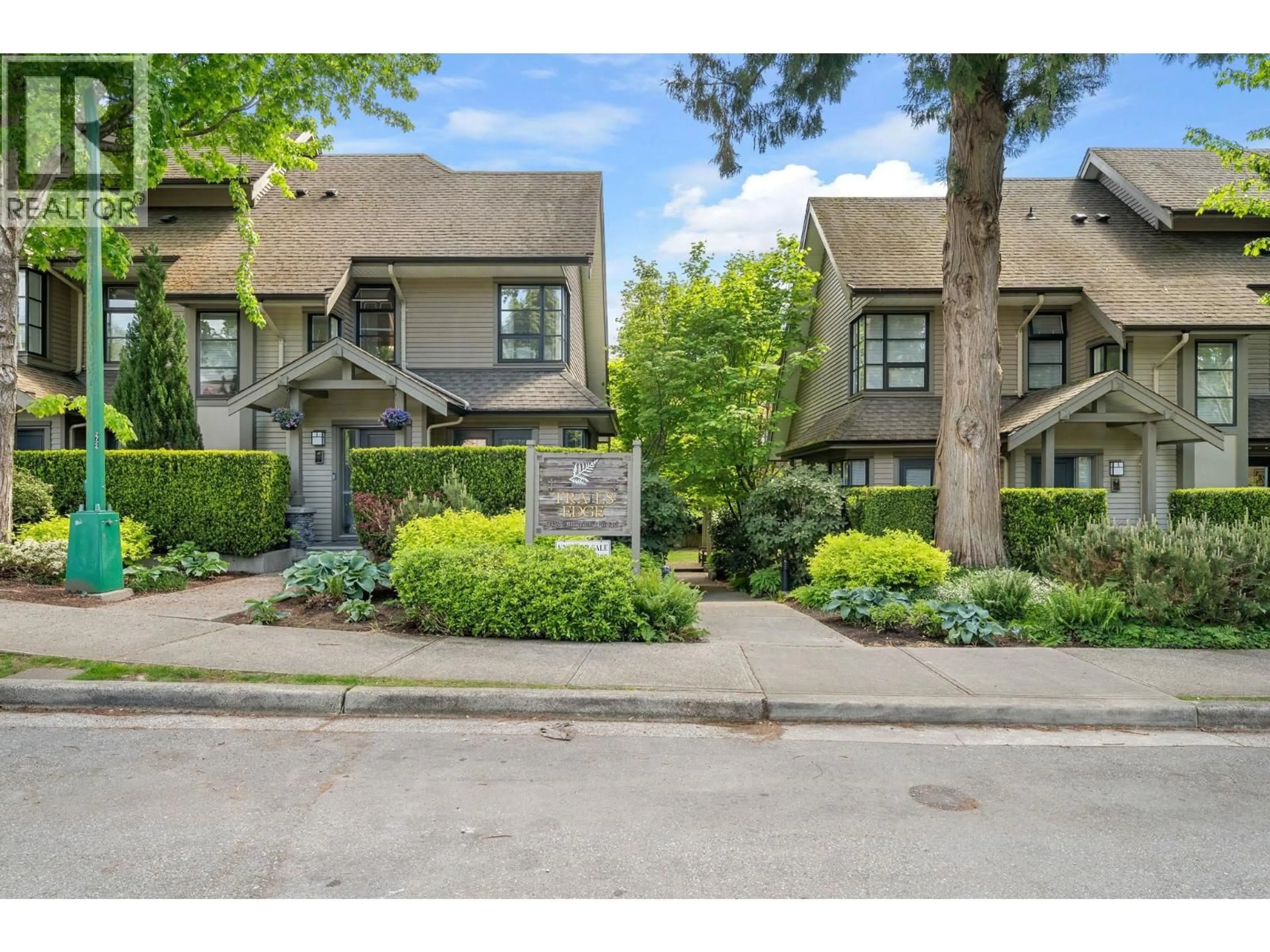 A pic from outside/outdoor area/front of a property/back of a property/a pic from drone, street for 15 - 3150 SUNNYHURST ROAD, North Vancouver British Columbia V7K2G3