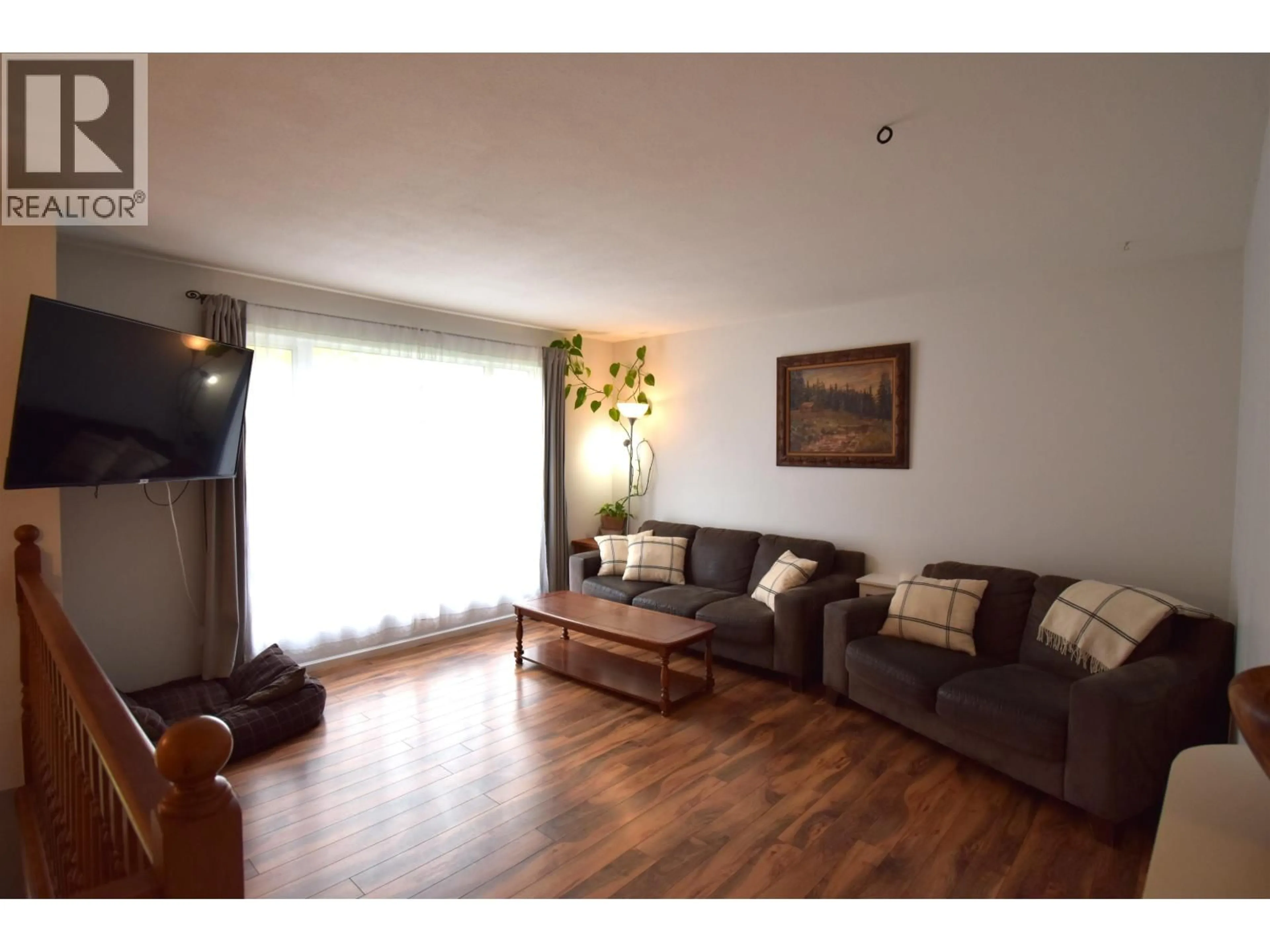Living room with furniture, wood/laminate floor for 1455 WILLOW STREET, Telkwa British Columbia V0J2X0