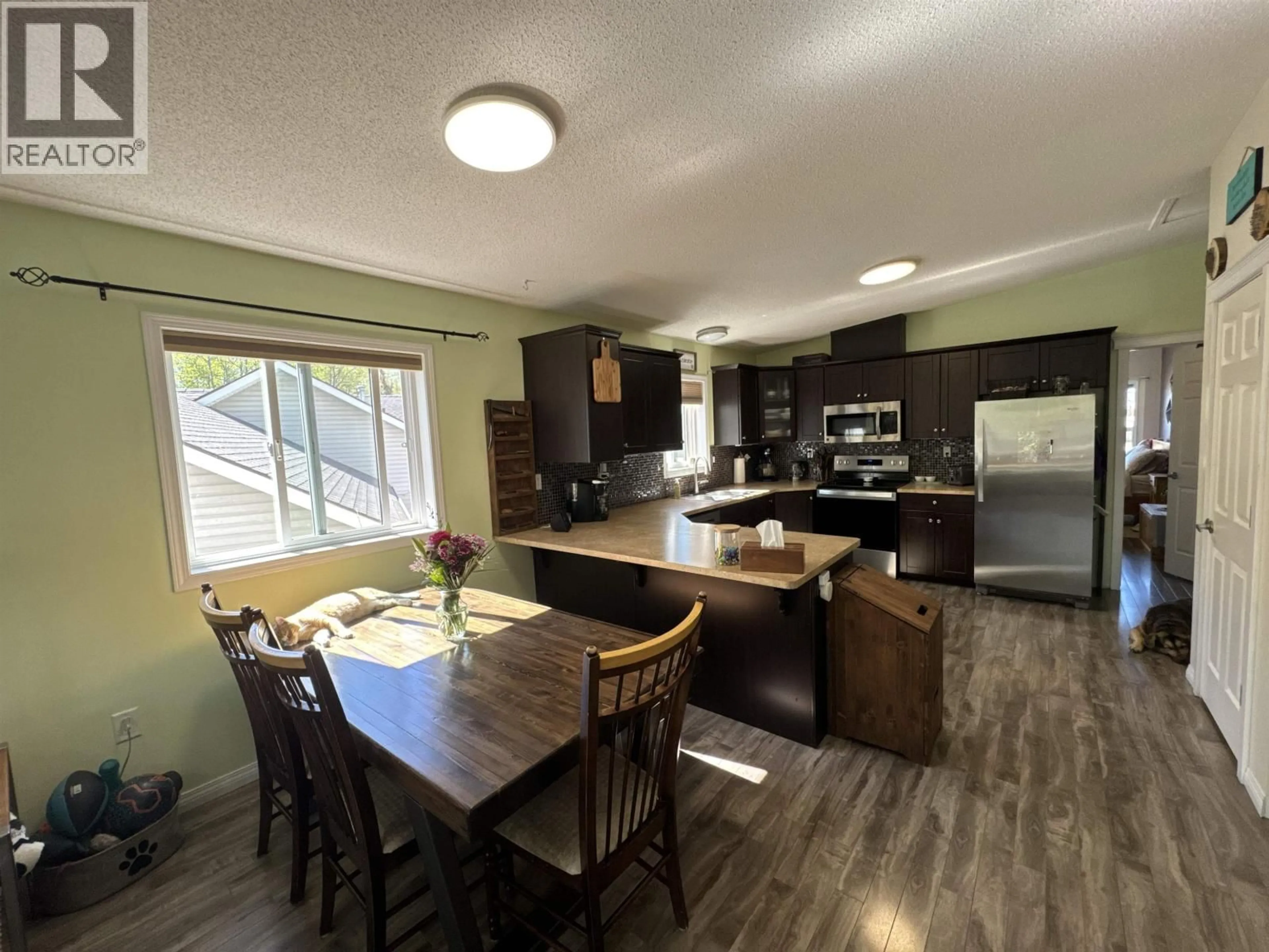 Open concept kitchen, wood/laminate floor for 9616 FAIRWAY AVENUE, Taylor British Columbia V0C2K0