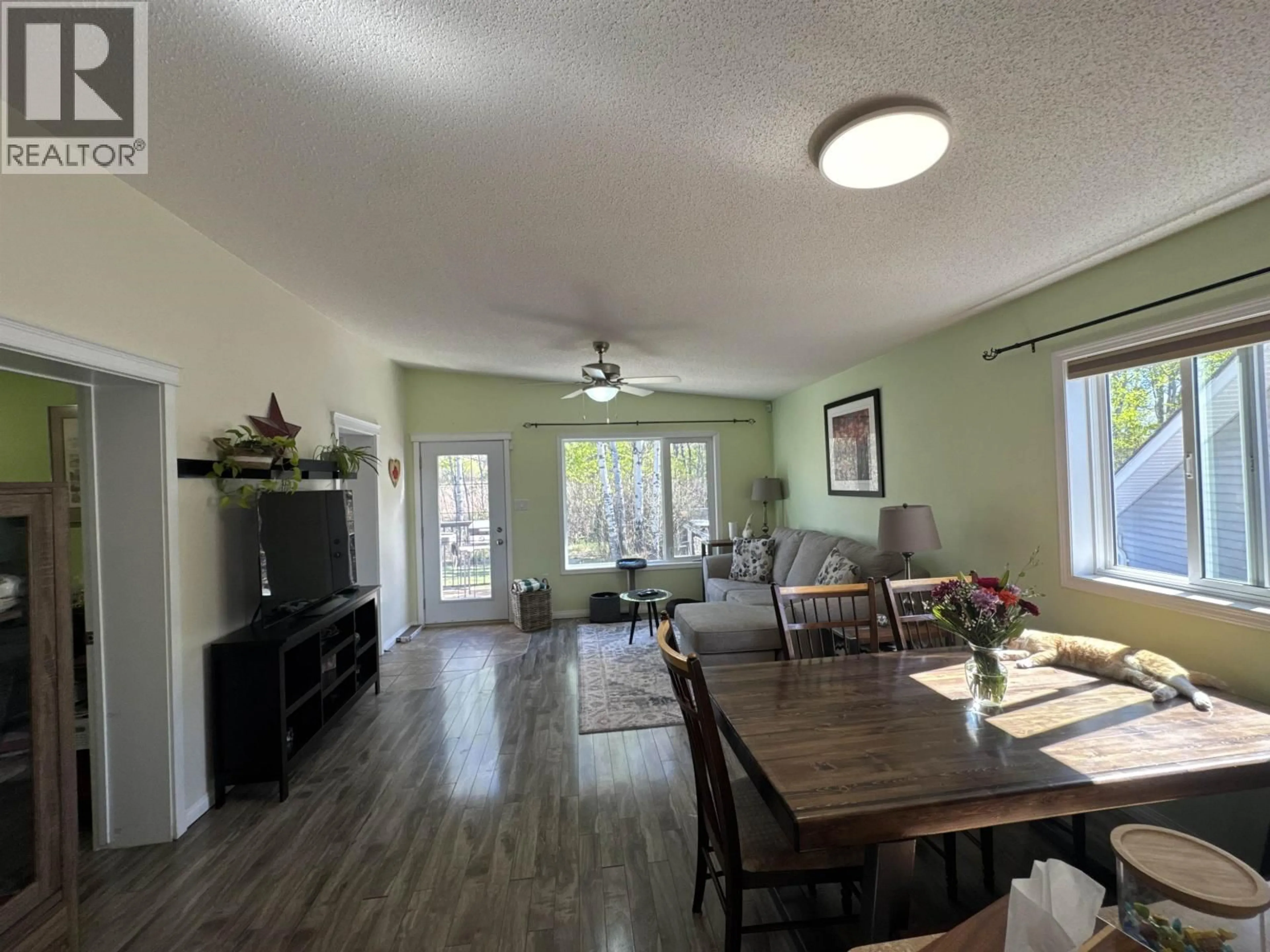 Living room with furniture, wood/laminate floor for 9616 FAIRWAY AVENUE, Taylor British Columbia V0C2K0
