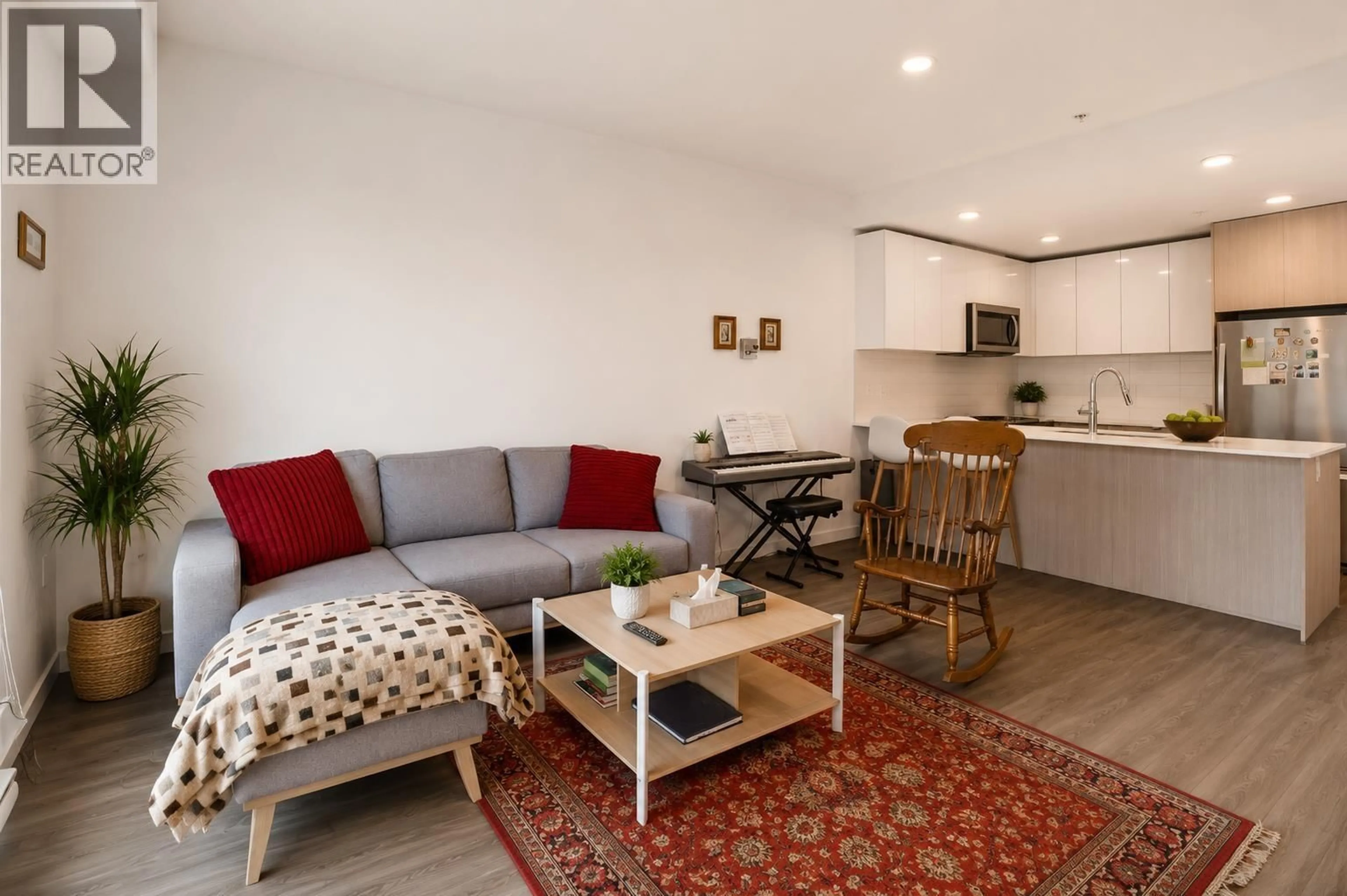 Living room with furniture, wood/laminate floor for 306 - 2236 WELCHER AVENUE, Port Coquitlam British Columbia V3C1X3
