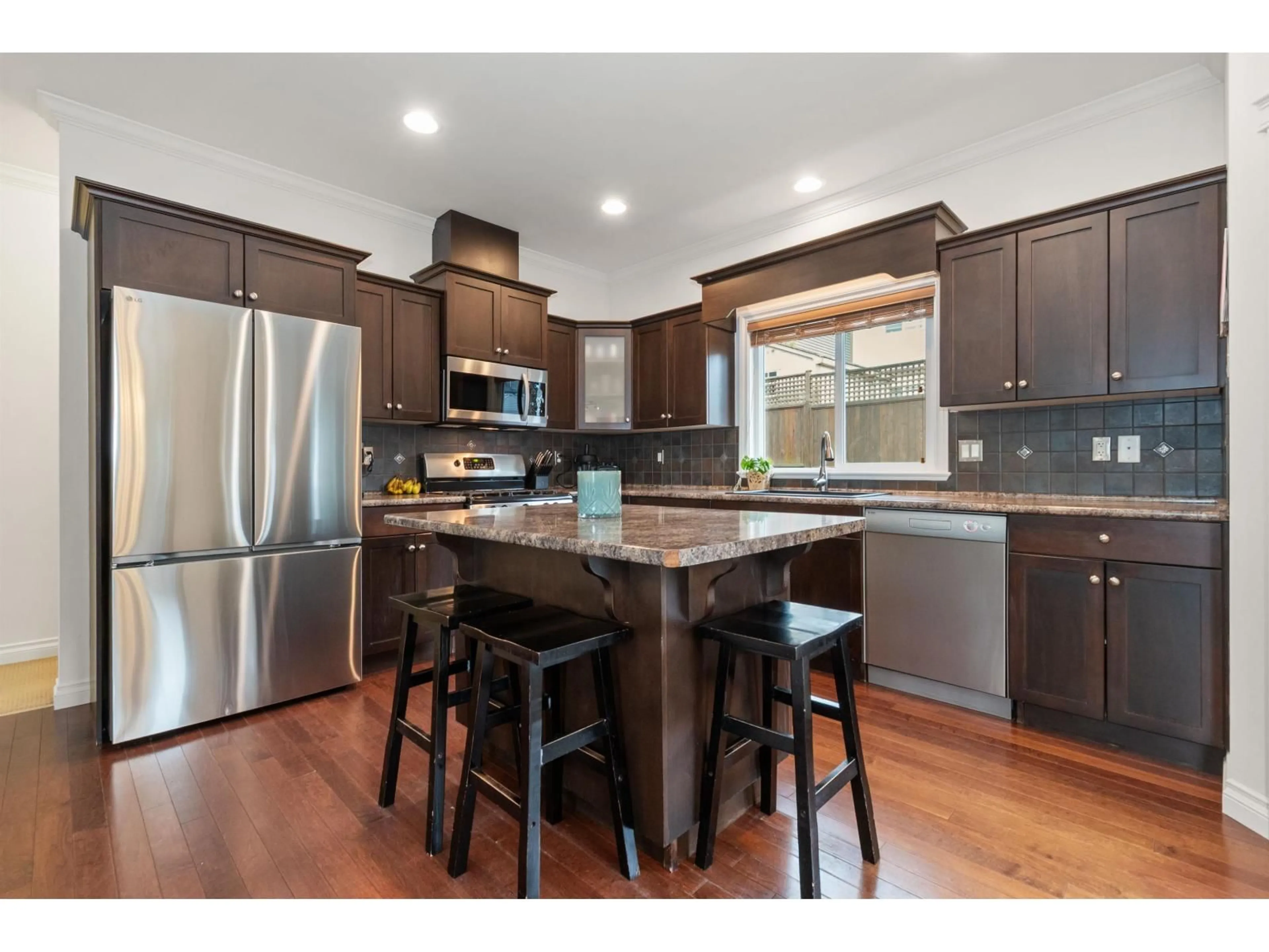Open concept kitchen, wood/laminate floor for 47216 LAUGHINGTON PLACE, Chilliwack British Columbia V2R0J3