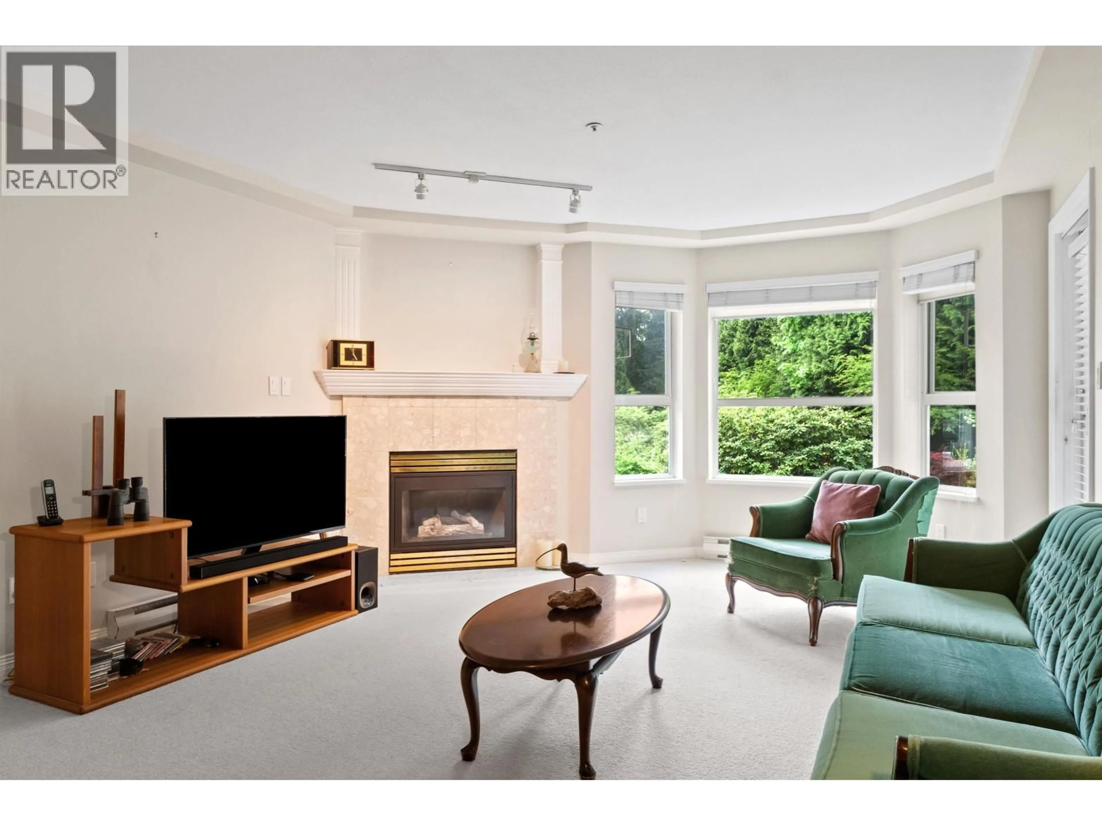 Living room with furniture, unknown for 206 - 1283 PARKGATE AVENUE, North Vancouver British Columbia V7H3A3