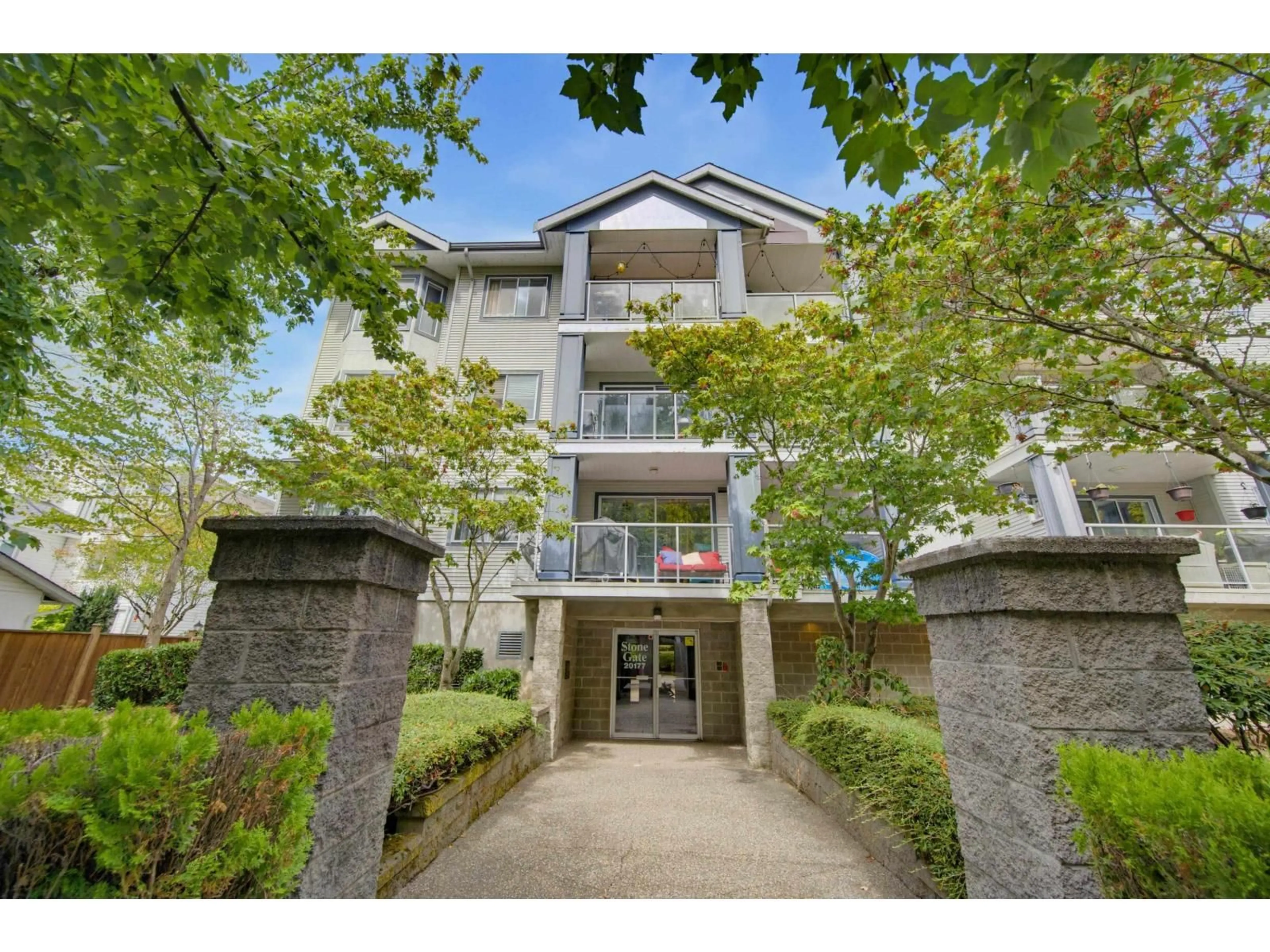 A pic from outside/outdoor area/front of a property/back of a property/a pic from drone, street for 314 - 20177 54A AVENUE, Langley British Columbia V3A3W6